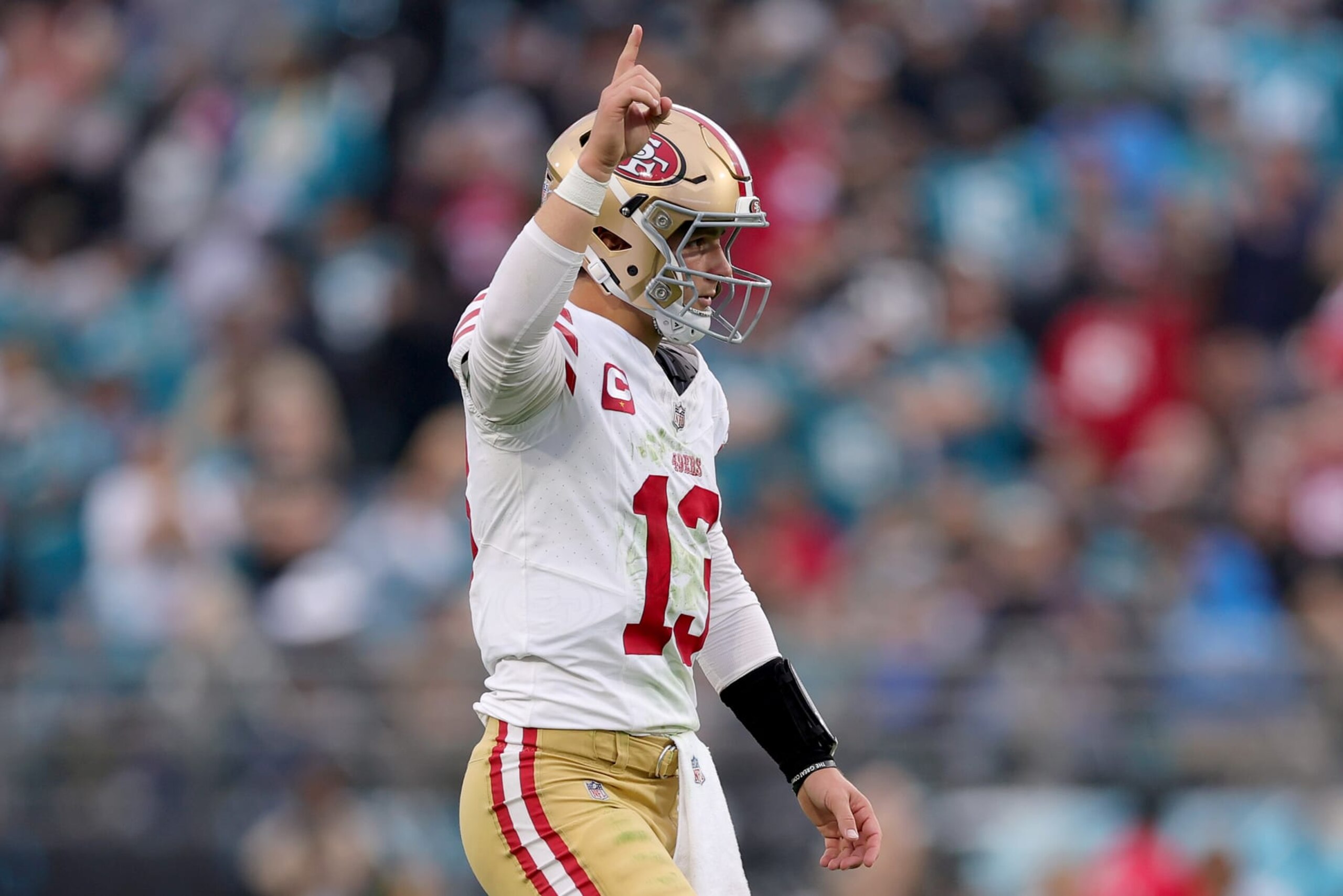 JACKSONVILLE, FLORIDA - NOVEMBER 12: Brock Purdy #13 of the San Francisco 49ers reacts after a touchdown pass during the third quarter against the Jacksonville Jaguars at EverBank Stadium on November 12, 2023 in Jacksonville, Florida. (Photo by Megan Briggs/Getty Images)