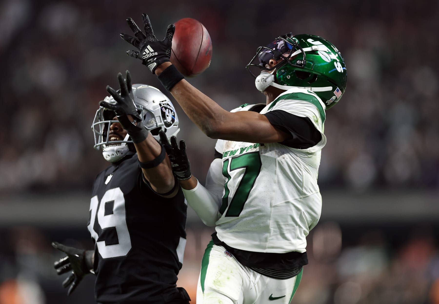 LAS VEGAS, NEVADA - NOVEMBER 12:  Wide receiver Garrett Wilson #17 of the New York Jets cannot hold on to the ball as cornerback Nate Hobbs #39 of the Las Vegas Raiders breaks up the pass during the 4th quarter of the game at Allegiant Stadium on November 12, 2023 in Las Vegas, Nevada. (Photo by Sean M. Haffey/Getty Images)