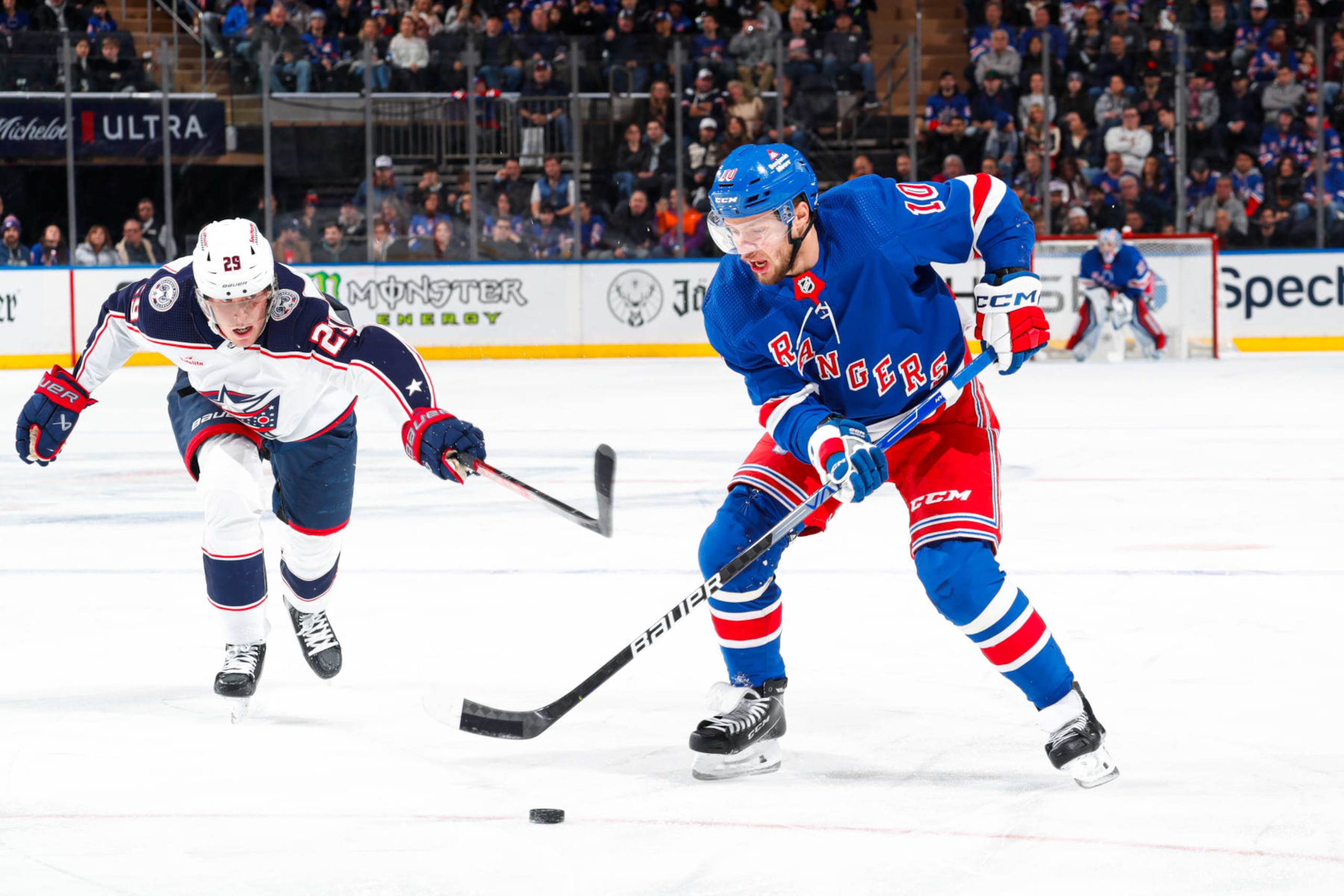 NEW YORK, NEW YORK - NOVEMBER 12: Artemi Panarin #10 of the New York Rangers skates with the puck against Patrik Laine #29 of the Columbus Blue Jackets at Madison Square Garden on November 12, 2023 in New York City. (Photo by Jared Silber/NHLI via Getty Images) NEW YORK, NEW YORK - NOVEMBER 12: Artemi Panarin #10 of the New York Rangers skates with the puck against Patrik Laine #29 of the Columbus Blue Jackets at Madison Square Garden on November 12, 2023 in New York City. (Photo by Jared Silber/NHLI via Getty Images)