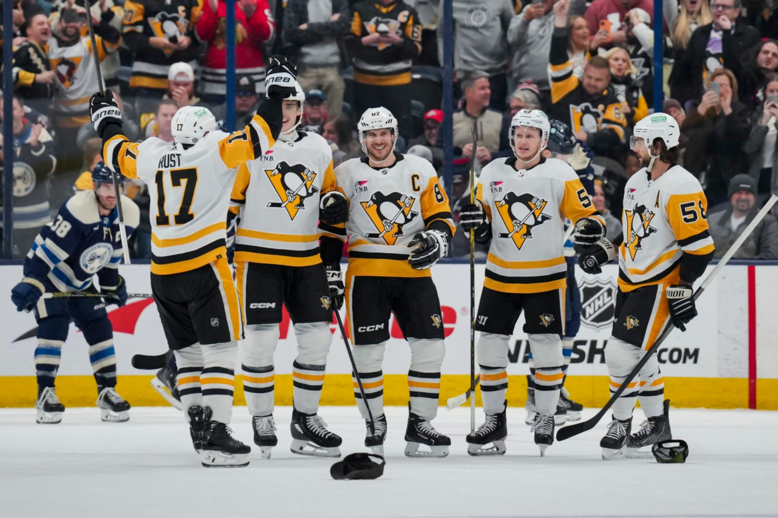 COLUMBUS, OHIO - NOVEMBER 14: Sidney Crosby #87 of the Pittsburgh Penguins celebrates with teammates after scoring a hat-trick goal in the third period of game against the Columbus Blue Jackets at Nationwide Arena on November 14, 2023 in Columbus, Ohio. (Photo by Aaron Doster/NHLI via Getty Images) COLUMBUS, OHIO - NOVEMBER 14: Sidney Crosby #87 of the Pittsburgh Penguins celebrates with teammates after scoring a hat-trick goal in the third period of game against the Columbus Blue Jackets at Nationwide Arena on November 14, 2023 in Columbus, Ohio. (Photo by Aaron Doster/NHLI via Getty Images)