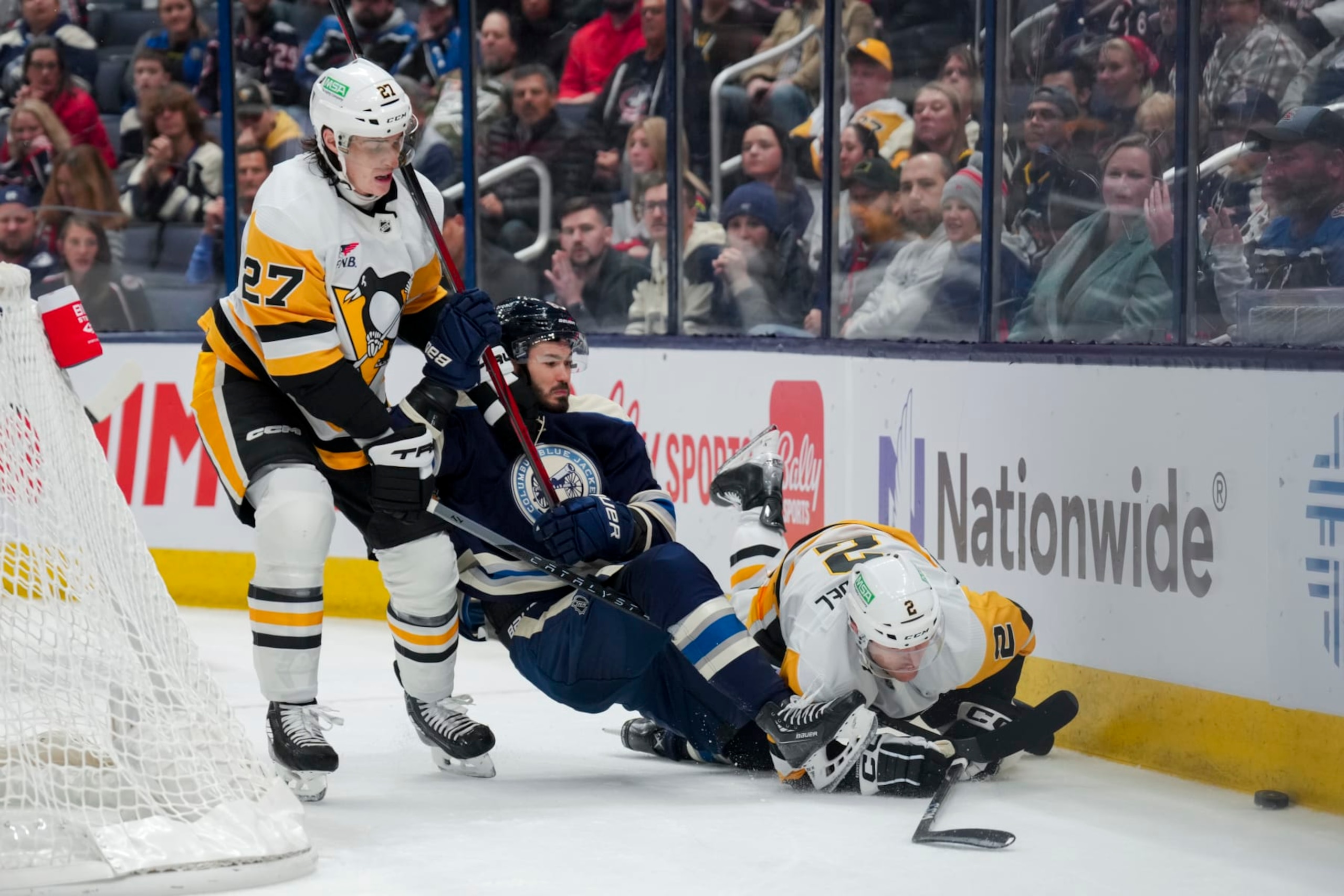 COLUMBUS, OHIO - NOVEMBER 14: Ryan Graves #27 of the Pittsburgh Penguins skates as Kirill Marchenko #86 of the Columbus Blue Jackets collides with Chad Ruhwedel #2 of the Pittsburgh Penguins in the third period of game at Nationwide Arena on November 14, 2023 in Columbus, Ohio. (Photo by Aaron Doster/NHLI via Getty Images) COLUMBUS, OHIO - NOVEMBER 14: Ryan Graves #27 of the Pittsburgh Penguins skates as Kirill Marchenko #86 of the Columbus Blue Jackets collides with Chad Ruhwedel #2 of the Pittsburgh Penguins in the third period of game at Nationwide Arena on November 14, 2023 in Columbus, Ohio. (Photo by Aaron Doster/NHLI via Getty Images)