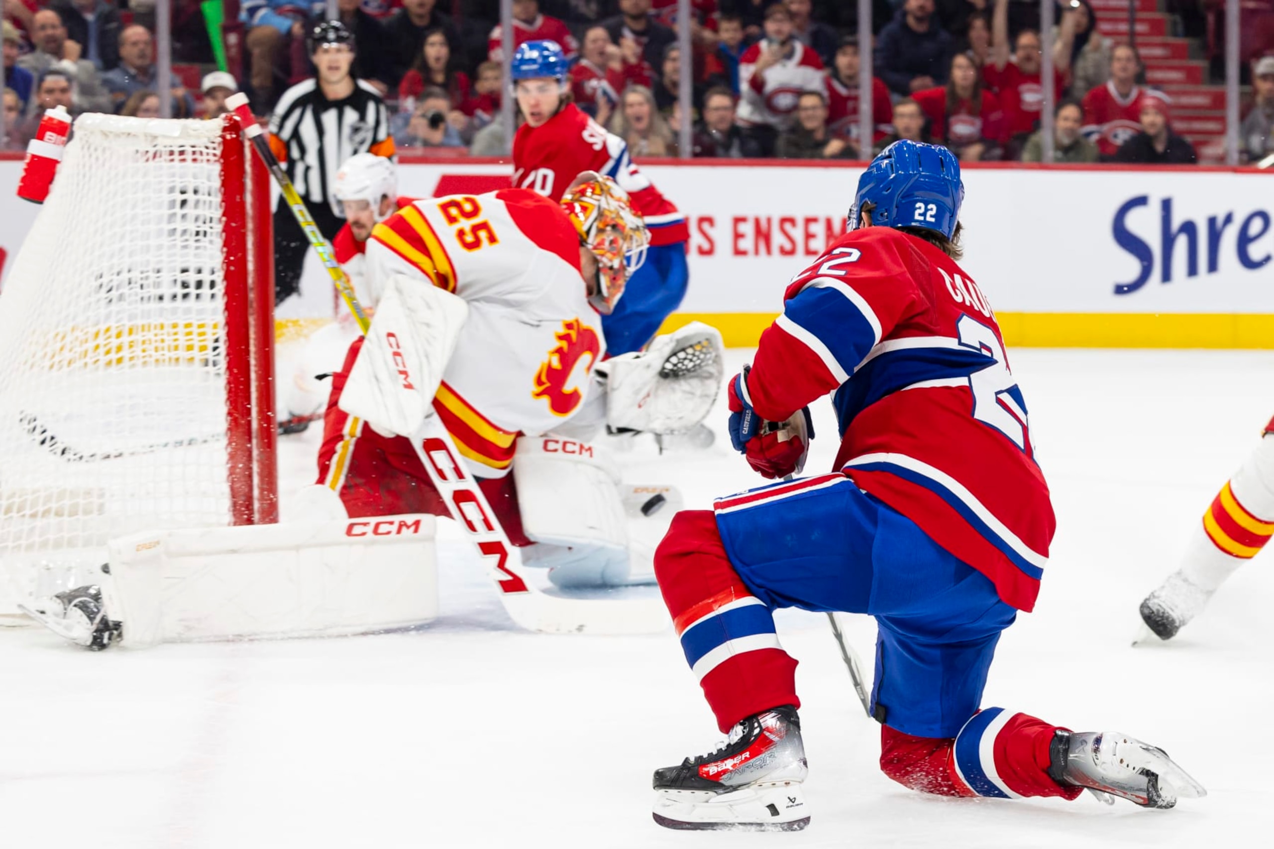 MONTREAL, CANADA - NOVEMBER 14: Jacob Markstrom #25 of the Calgary Flames makes a pad save on Cole Caufield #22 of the Montreal Canadiens during the first period of the NHL regular season game between the Montreal Canadiens and the Calgary Flames at the Bell Centre on November 14, 2023 in Montreal, Quebec, Canada. (Photo by Vitor Munhoz/NHLI via Getty Images) MONTREAL, CANADA - NOVEMBER 14: Jacob Markstrom #25 of the Calgary Flames makes a pad save on Cole Caufield #22 of the Montreal Canadiens during the first period of the NHL regular season game between the Montreal Canadiens and the Calgary Flames at the Bell Centre on November 14, 2023 in Montreal, Quebec, Canada. (Photo by Vitor Munhoz/NHLI via Getty Images)