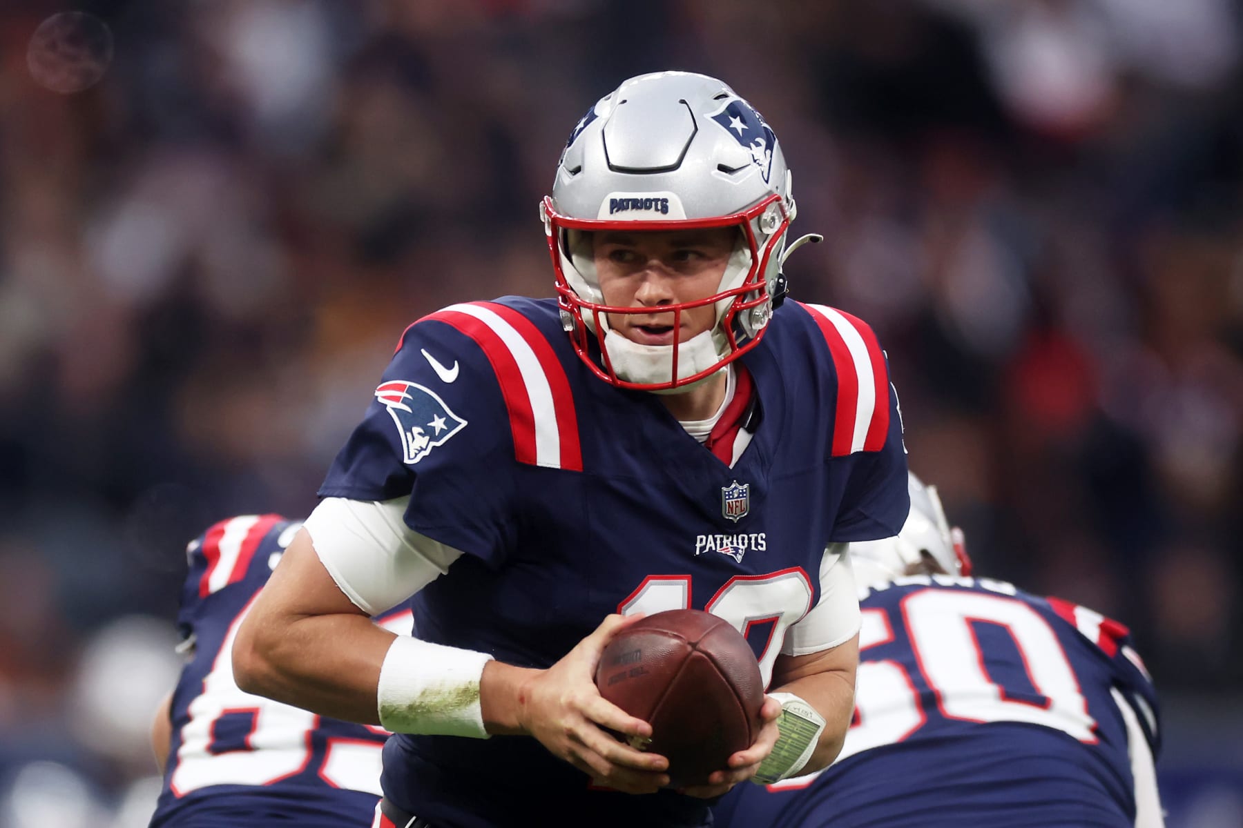 FRANKFURT AM MAIN, GERMANY - NOVEMBER 12: Mac Jones #10 of the New England Patriots looks to hand the ball off in the second quarter during the NFL match between the Indianapolis Colts and the New England Patriots at Deutsche Bank Park on November 12, 2023 in Frankfurt am Main, Germany. (Photo by Alex Grimm/Getty Images)