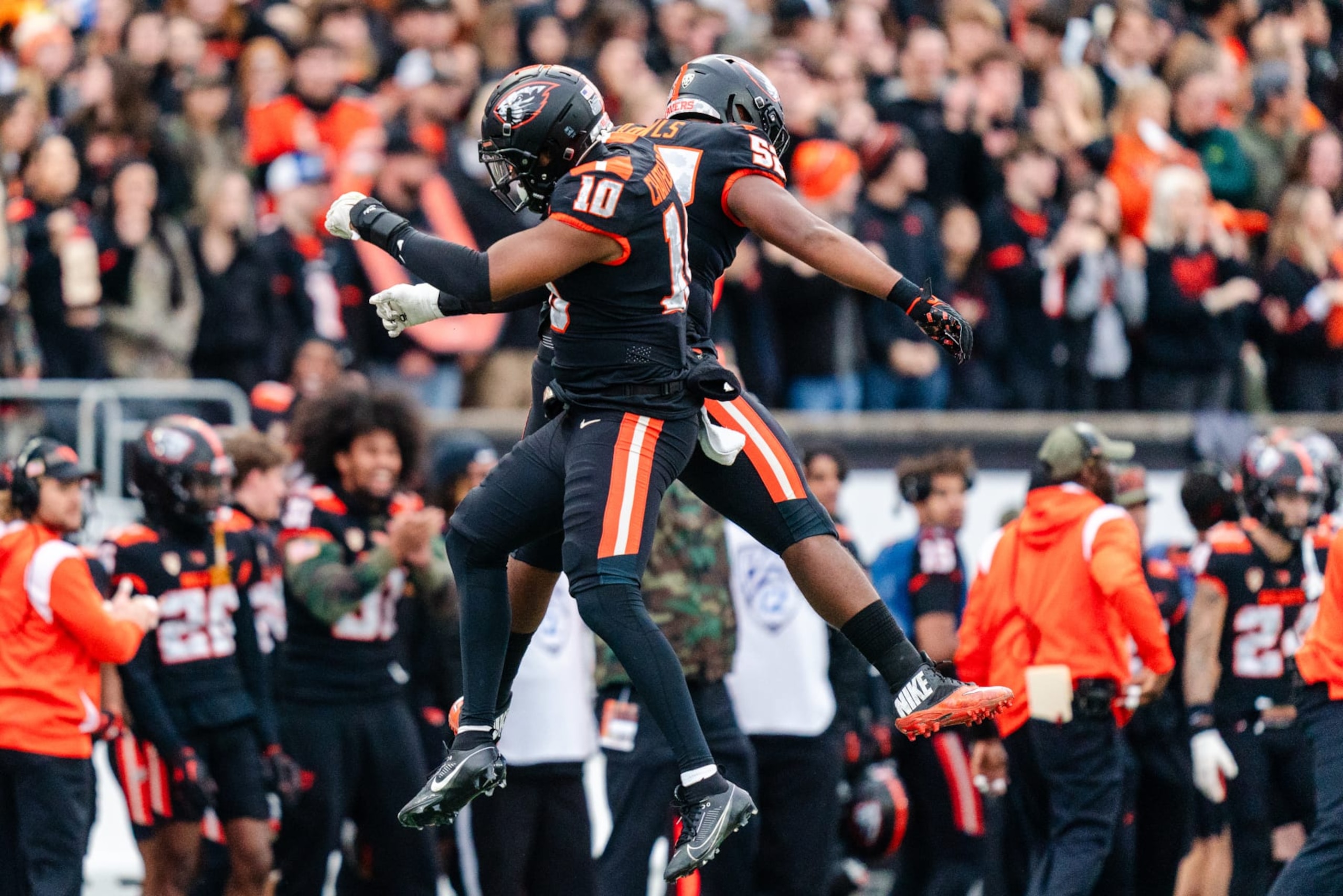 CORVALLIS, OREGON - NOVEMBER 11: Linebacker Andrew Chatfield Jr. #10 and defensive lineman James Rawls #52 of the Oregon State Beavers react after a defensive play during the first half of the game against the Stanford Cardinals at Reser Stadium on November 11, 2023 in Corvallis, Oregon. (Photo by Ali Gradischer/Getty Images)