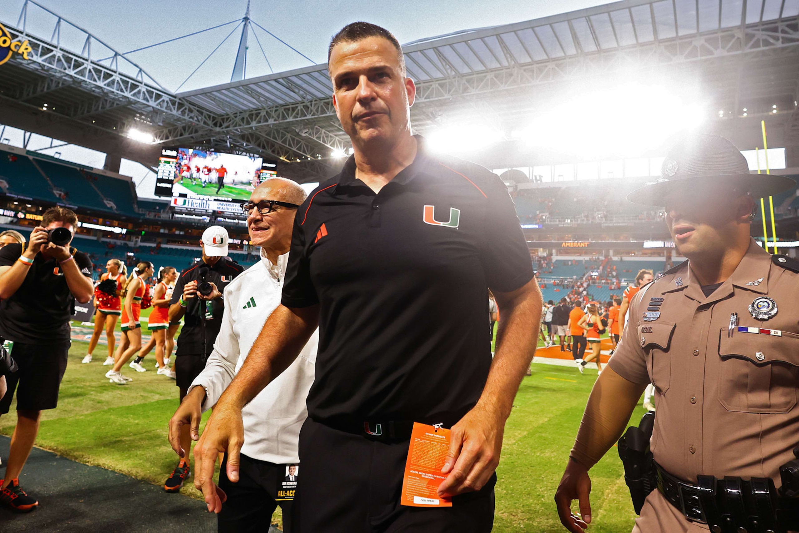 MIAMI GARDENS, FLORIDA - OCTOBER 28: Head coach Mario Cristobal of the Miami Hurricanes walks off the field after defeating the Virginia Cavaliers in overtime at Hard Rock Stadium on October 28, 2023 in Miami Gardens, Florida. (Photo by Megan Briggs/Getty Images)
