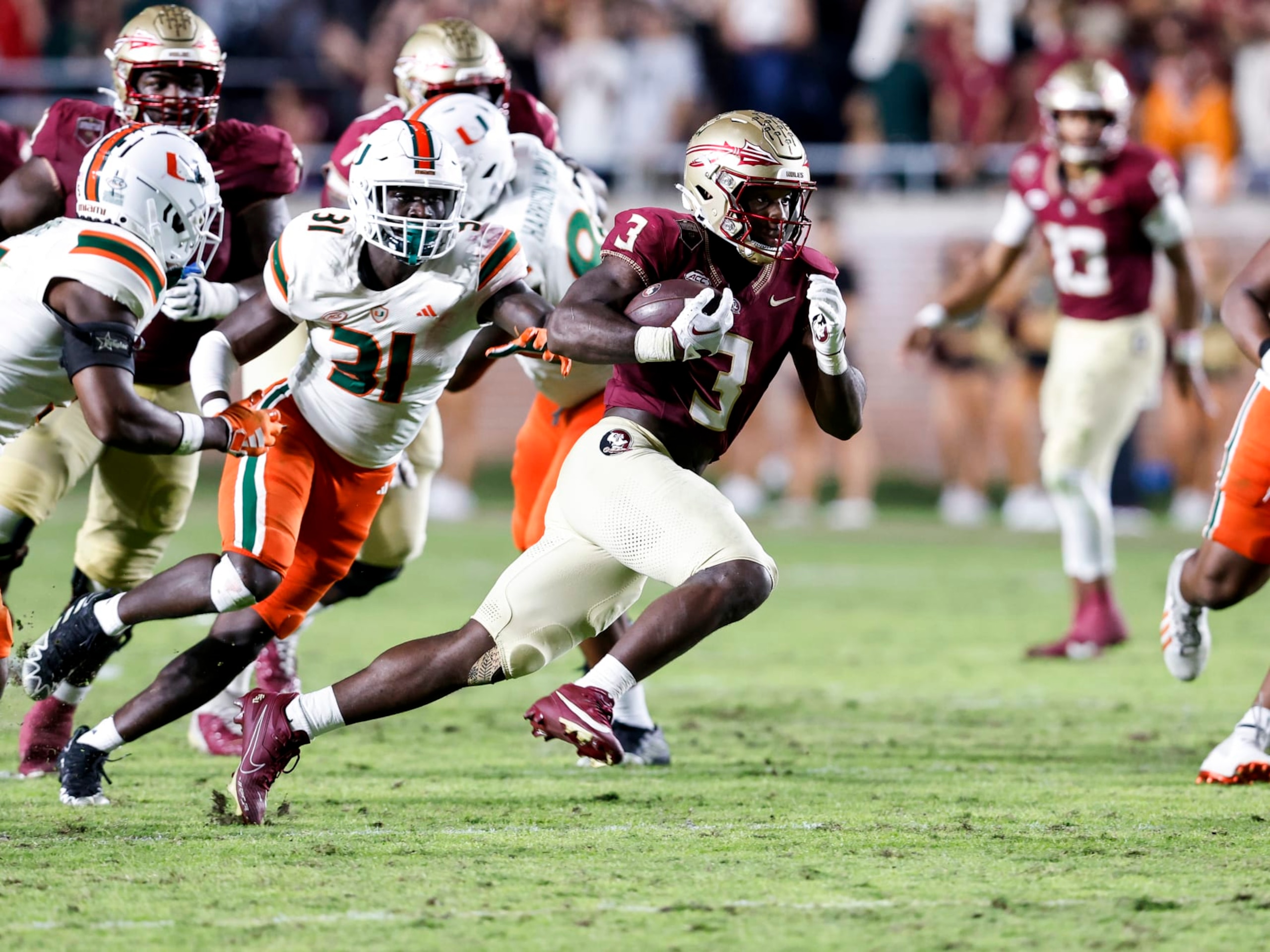 TALLAHASSEE, FL - NOVEMBER 11: Running Back Trey Benson #3 of the Florida State Seminoles runs during the game against the Miami Hurricanes at Bobby Bowden Field at Doak Campbell Stadium on November 11, 2023 in Tallahassee, Florida. The 4th ranked Seminoles defeated the Hurricanes 27-20. (Photo by Don Juan Moore/Getty Images)