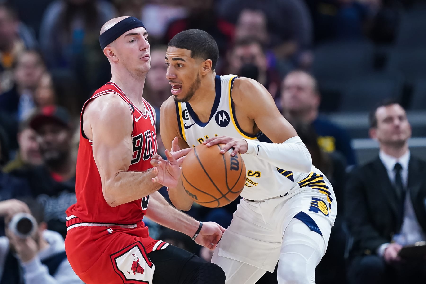 INDIANAPOLIS, INDIANA - FEBRUARY 15: Tyrese Haliburton #0 of the Indiana Pacers dribbles the ball while being guarded by Alex Caruso #6 of the Chicago Bulls in the first quarter at Gainbridge Fieldhouse on February 15, 2023 in Indianapolis, Indiana. NOTE TO USER: User expressly acknowledges and agrees that, by downloading and or using this photograph, User is consenting to the terms and conditions of the Getty Images License Agreement. (Photo by Dylan Buell/Getty Images)