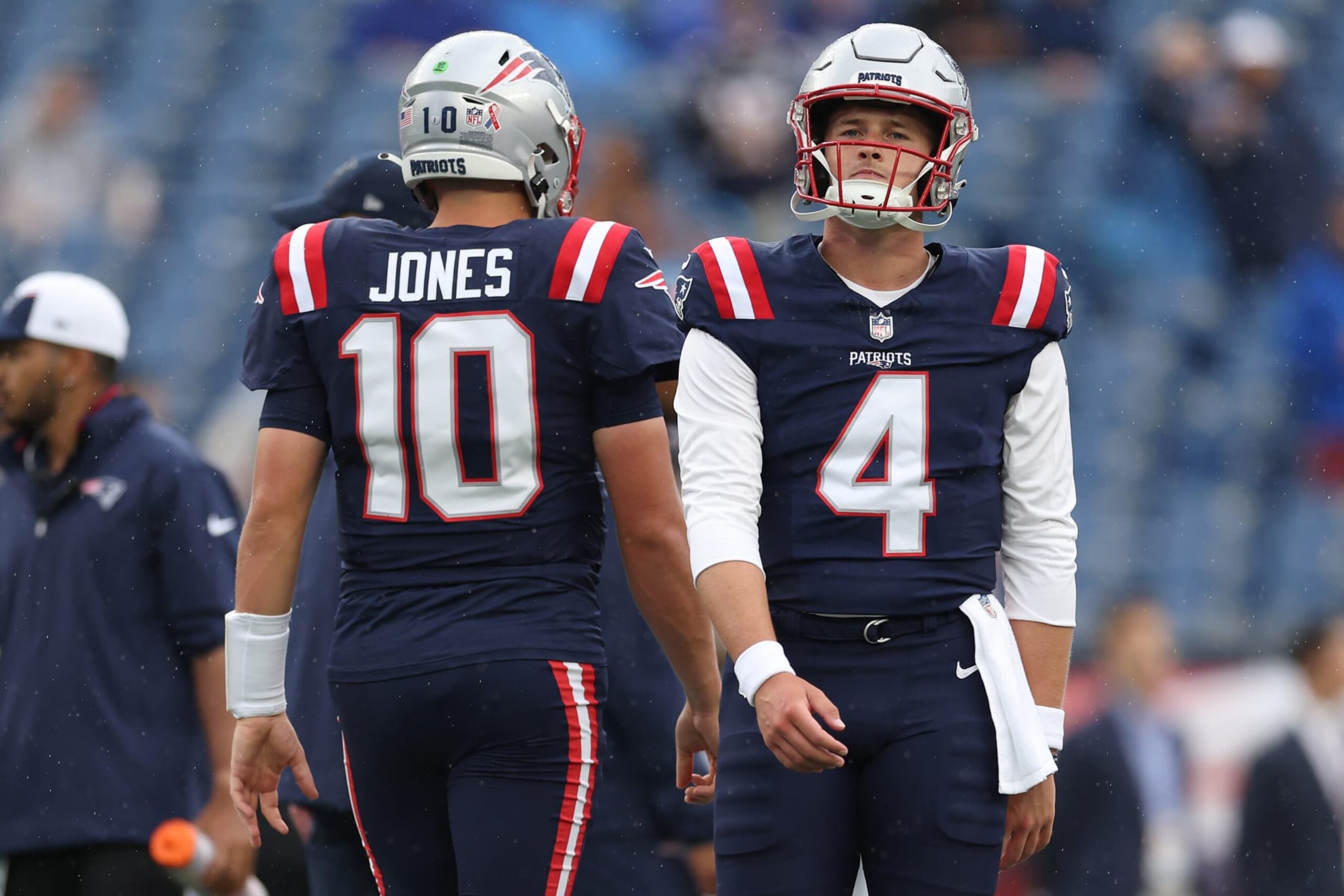 FOXBOROUGH, MASSACHUSETTS - SEPTEMBER 10: Mac Jones #10 of the New England Patriots and Bailey Zappe #4 of the New England Patriots warm up before their game against the Philadelphia Eagles at Gillette Stadium on September 10, 2023 in Foxborough, Massachusetts. (Photo by Maddie Meyer/Getty Images) FOXBOROUGH, MASSACHUSETTS - SEPTEMBER 10: Mac Jones #10 of the New England Patriots and Bailey Zappe #4 of the New England Patriots warm up before their game against the Philadelphia Eagles at Gillette Stadium on September 10, 2023 in Foxborough, Massachusetts. (Photo by Maddie Meyer/Getty Images)