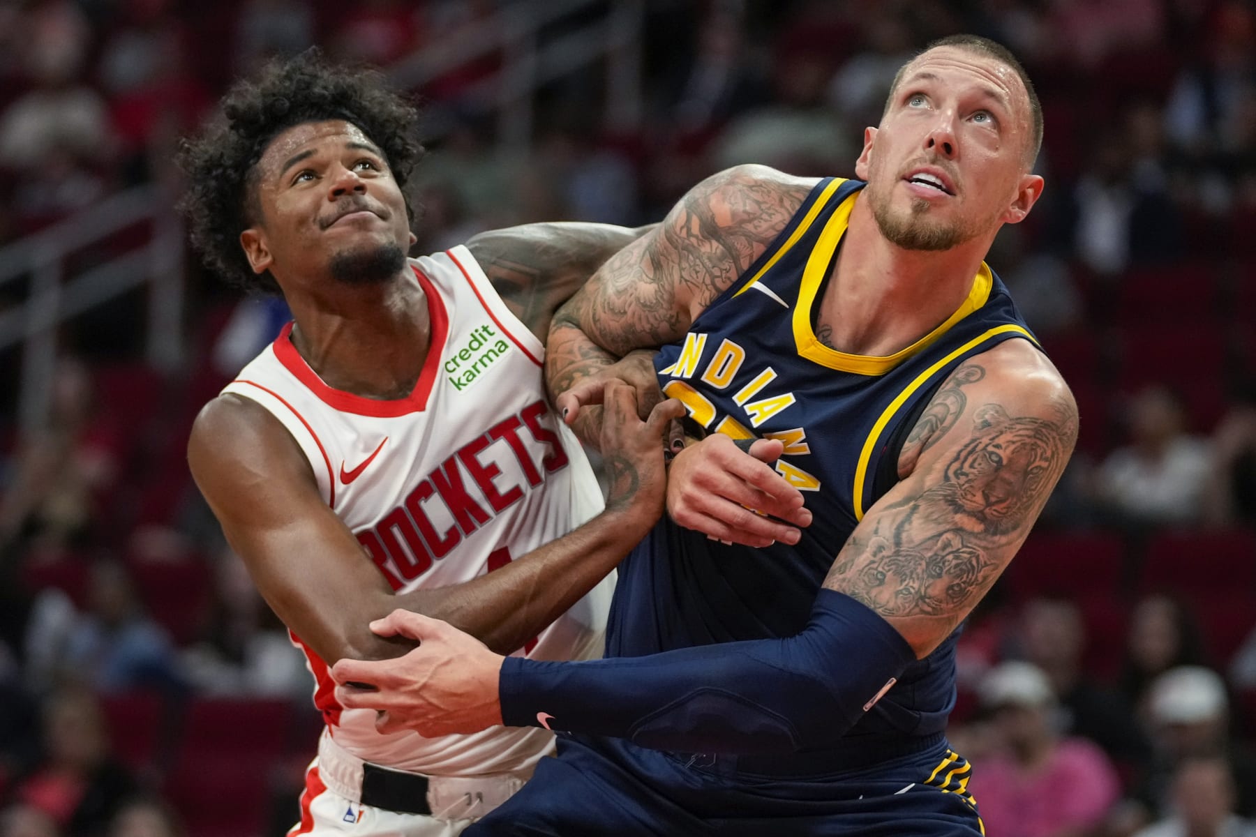 Houston Rockets guard Jalen Green, left, and Indiana Pacers center Daniel Theis watch a free throw during the second half of an NBA preseason basketball game Tuesday, Oct. 10, 2023, in Houston. (AP Photo/Eric Christian Smith)