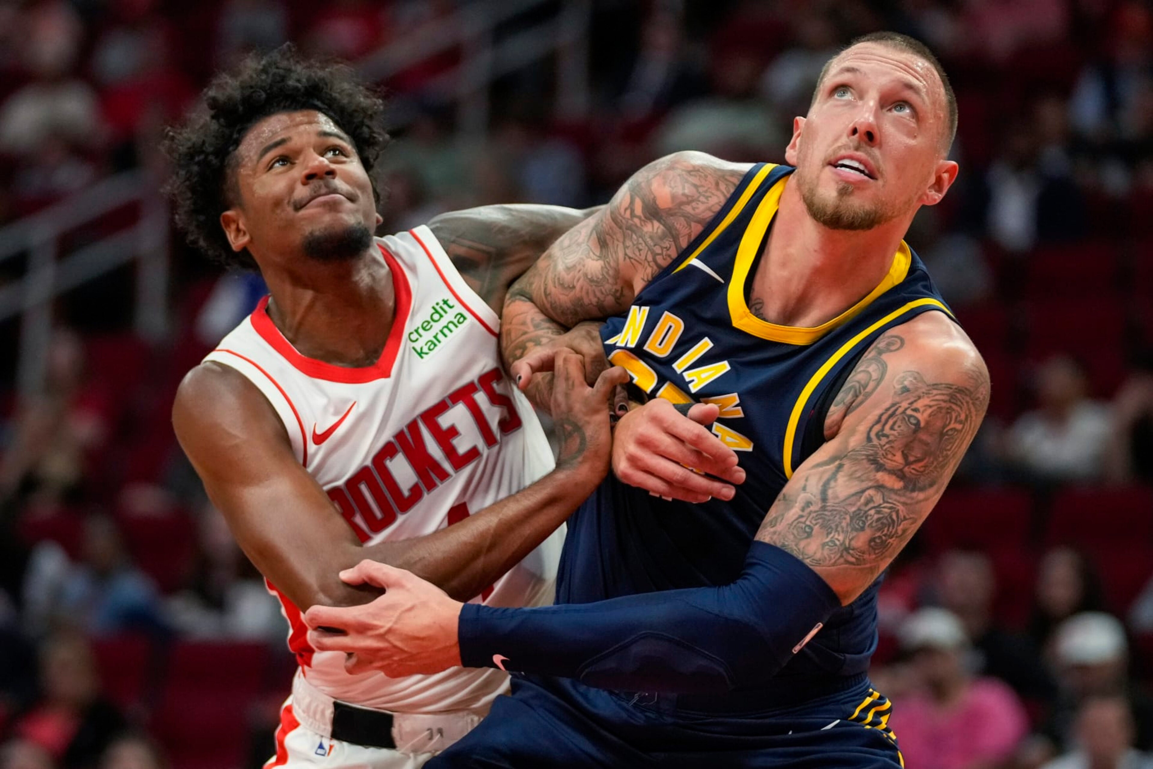 Houston Rockets guard Jalen Green, left, and Indiana Pacers center Daniel Theis watch a free throw during the second half of an NBA preseason basketball game Tuesday, Oct. 10, 2023, in Houston. (AP Photo/Eric Christian Smith)