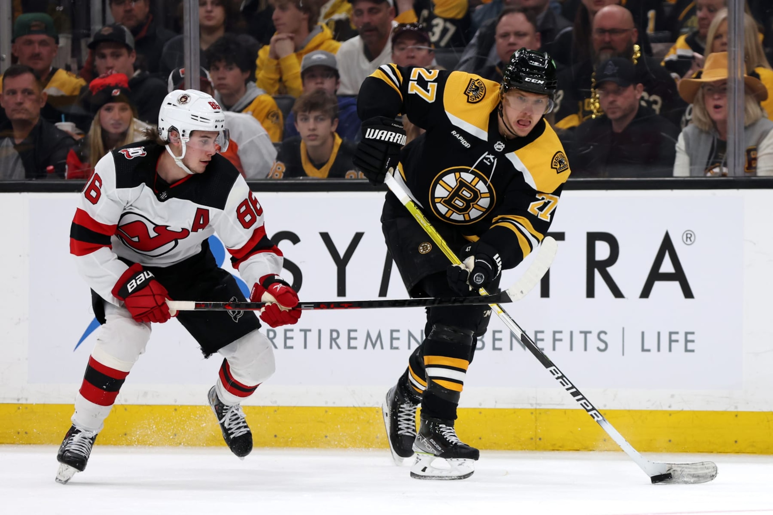 BOSTON, MASSACHUSETTS - APRIL 08: Hampus Lindholm #27 of the Boston Bruins skates against Jack Hughes #86 of the New Jersey Devils during the second period at TD Garden on April 08, 2023 in Boston, Massachusetts. (Photo by Maddie Meyer/Getty Images) BOSTON, MASSACHUSETTS - APRIL 08: Hampus Lindholm #27 of the Boston Bruins skates against Jack Hughes #86 of the New Jersey Devils during the second period at TD Garden on April 08, 2023 in Boston, Massachusetts. (Photo by Maddie Meyer/Getty Images)