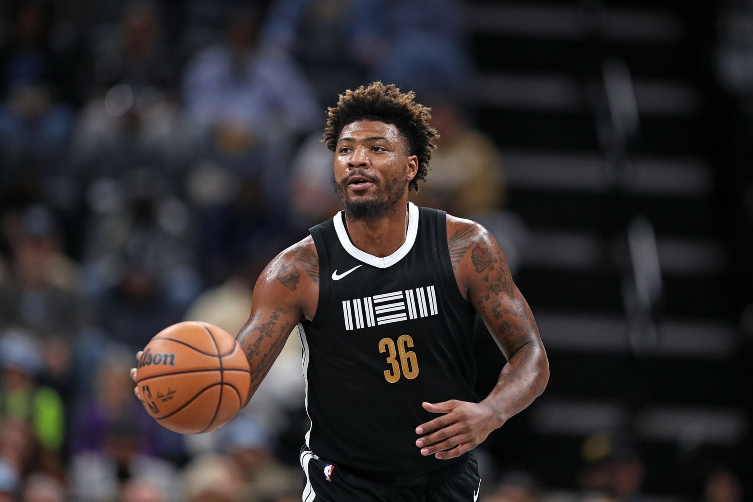 MEMPHIS, TENNESSEE - NOVEMBER 10: Marcus Smart #36 of the Memphis Grizzlies brings the ball up court during the game against the Utah Jazz at FedExForum on November 10, 2023 in Memphis, Tennessee. NOTE TO USER: User expressly acknowledges and agrees that, by downloading and or using this photograph, User is consenting to the terms and conditions of the Getty Images License Agreement. (Photo by Justin Ford/Getty Images)