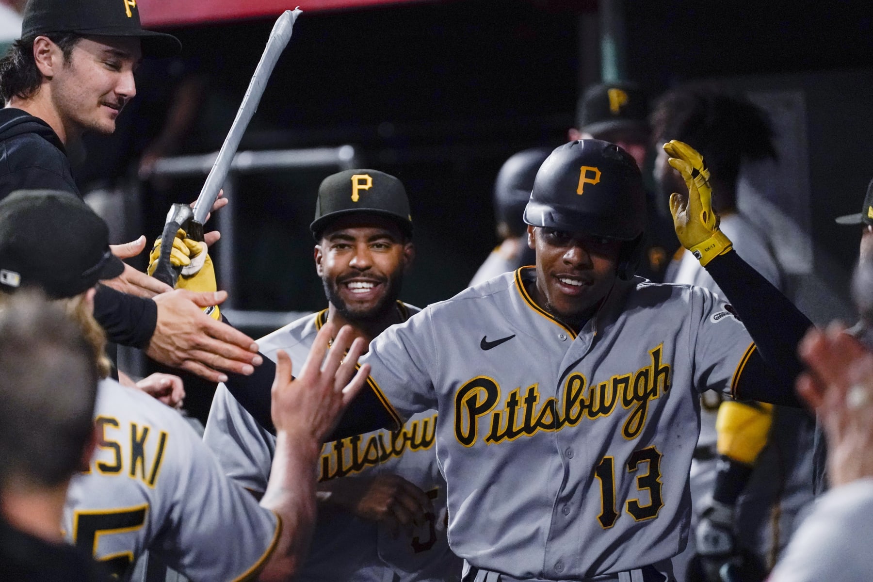 Pittsburgh Pirates' Ke'Bryan Hayes is congratulated after his solo home run against the Cincinnati Reds during the fourth inning of a baseball game Friday, Sept. 22, 2023, in Cincinnati. (AP Photo/Joshua A. Bickel)