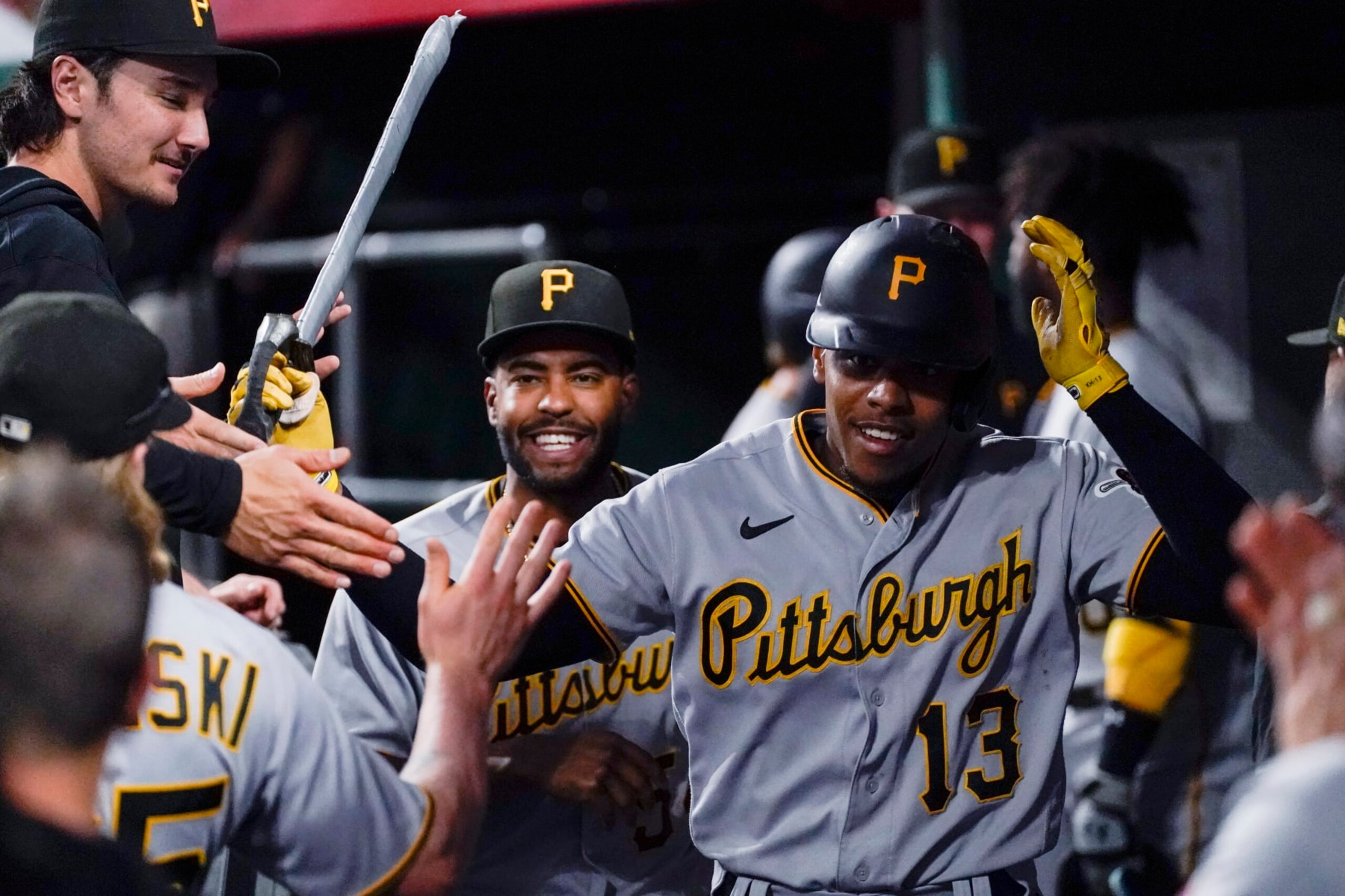 Pittsburgh Pirates' Ke'Bryan Hayes is congratulated after his solo home run against the Cincinnati Reds during the fourth inning of a baseball game Friday, Sept. 22, 2023, in Cincinnati. (AP Photo/Joshua A. Bickel)