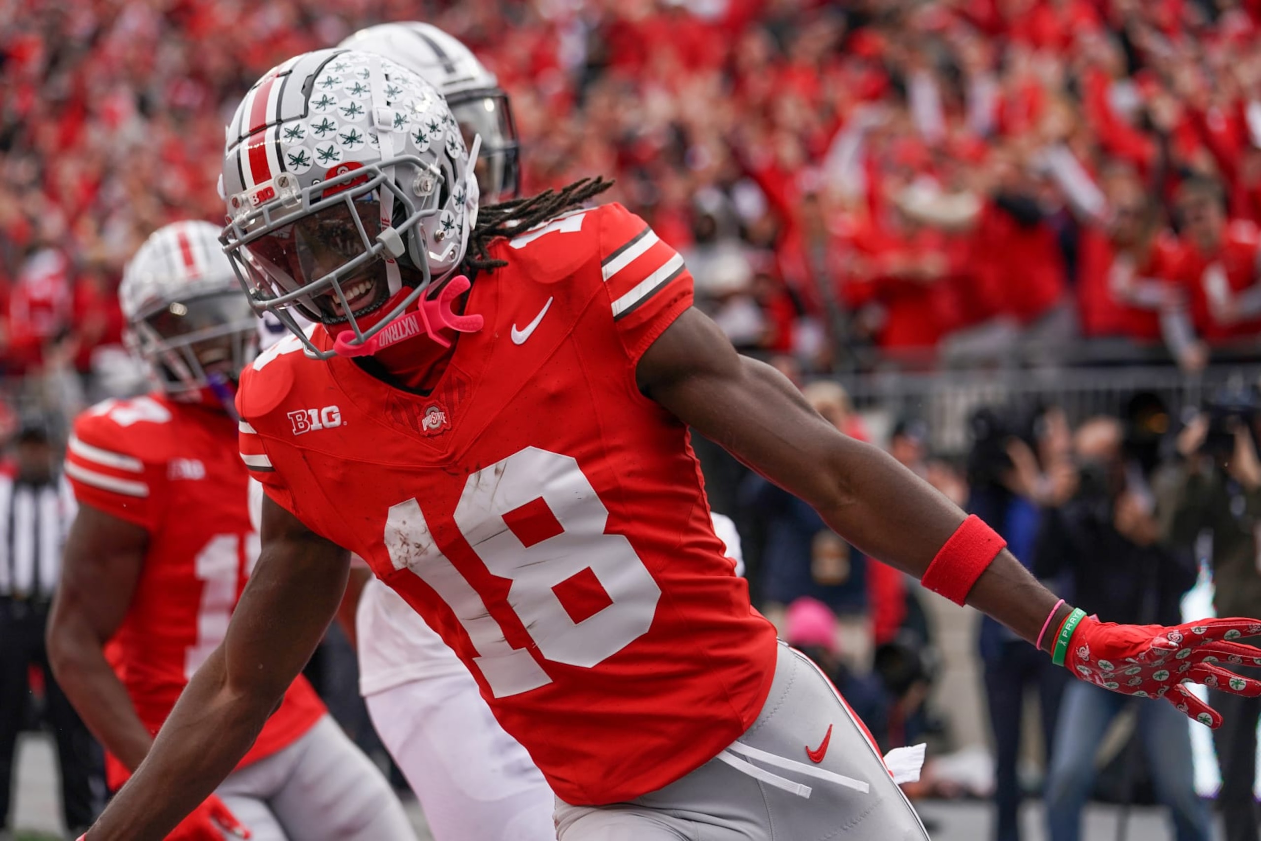 COLUMBUS, OH - OCTOBER 21: Wide receiver Marvin Harrison Jr. #18 of the Ohio State Buckeyes celebrates a touchdown during the game against the Penn State Nittany Lionsat Ohio Stadium in Columbus, Ohio on October 21, 2023. (Photo by Jason Mowry/Icon Sportswire via Getty Images)