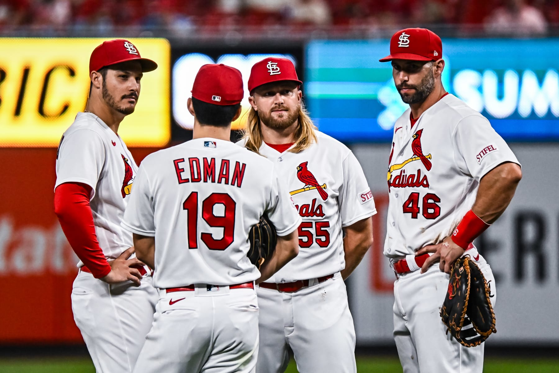 ST. LOUIS, MO - Aug 15: St. Louis Cardinals third baseman Nolan Arenado (28), St. Louis Cardinals shortstop Tommy Edman (19), St. Louis Cardinals second baseman Taylor Motter (55) and St. Louis Cardinals first baseman Paul Goldschmidt (46) wait for the relief pitcher to warm up during a game between the Oakland Athletics and the St. Louis Cardinals on August 15, 2023, at Busch Stadium in St. Louis MO (Photo by Rick Ulreich/Icon Sportswire via Getty Images)