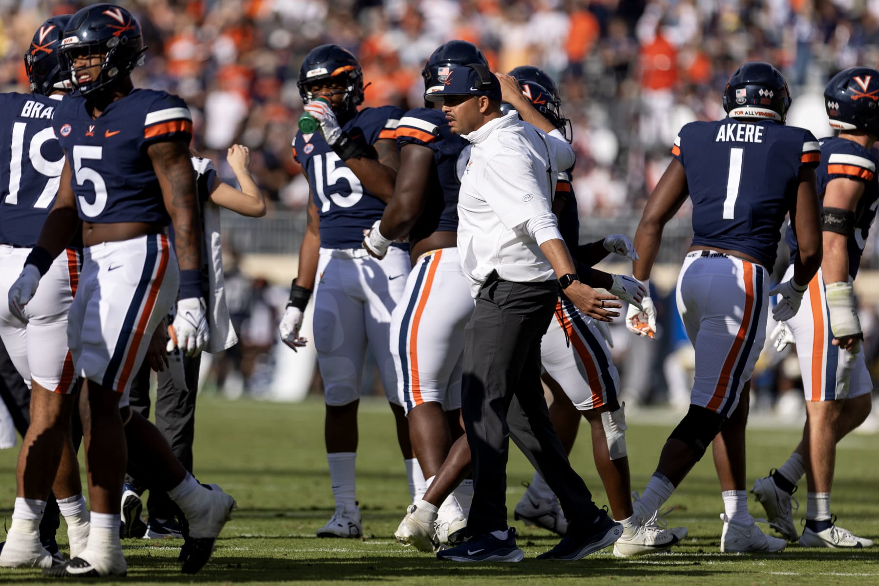 CHARLOTTESVILLE, VIRGINIA - NOVEMBER 4: Head coach Tony Elliott of the Virginia Cavaliers talks to players during a time out in the first half during a game at Scott Stadium on November 4, 2023 in Charlottesville, Virginia. (Photo by Ryan M. Kelly/Getty Images)