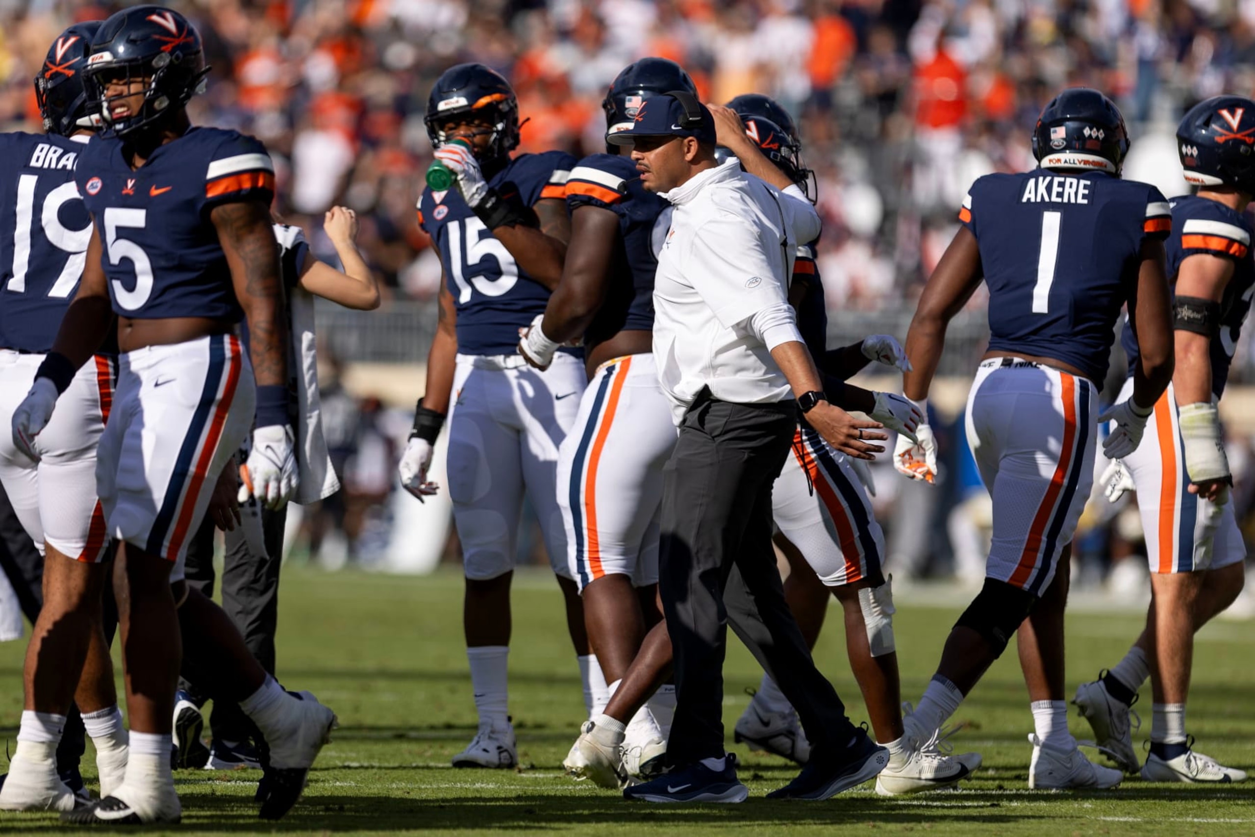 CHARLOTTESVILLE, VIRGINIA - NOVEMBER 4: Head coach Tony Elliott of the Virginia Cavaliers talks to players during a time out in the first half during a game at Scott Stadium on November 4, 2023 in Charlottesville, Virginia. (Photo by Ryan M. Kelly/Getty Images)