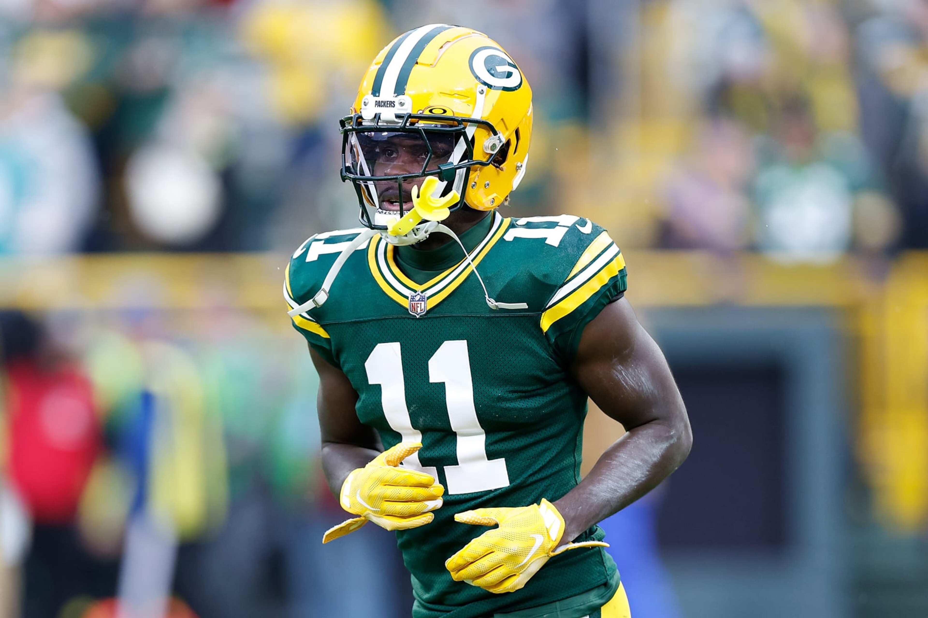 GREEN BAY, WISCONSIN - NOVEMBER 05: Jayden Reed #11 of the Green Bay Packers runs onto the field after halftime against the Los Angeles Rams at Lambeau Field on November 05, 2023 in Green Bay, Wisconsin. (Photo by John Fisher/Getty Images)