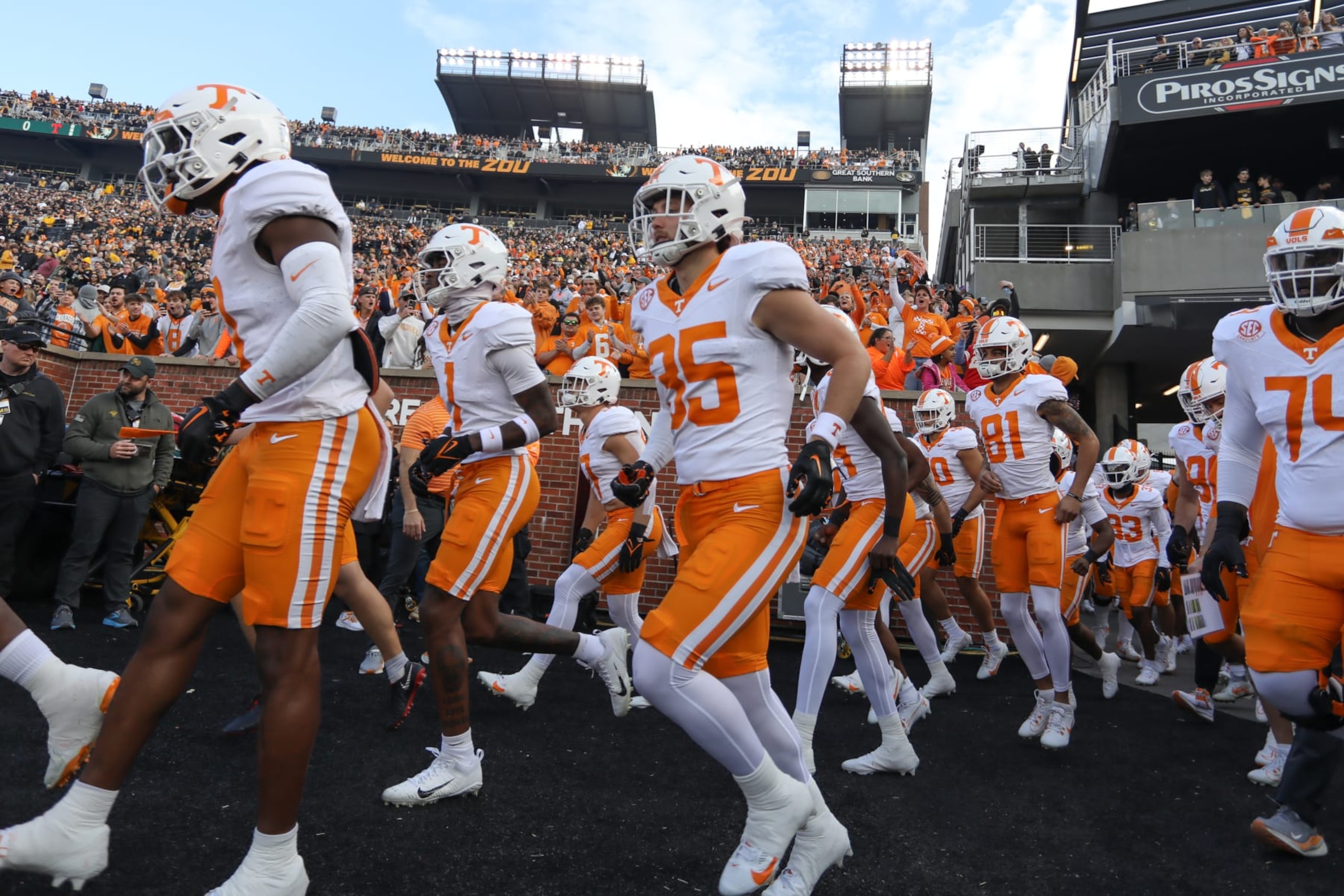 COLUMBIA, MO - NOVEMBER 11: Tennessee Volunteers players run onto the field before an SEC football game between the Tennessee Volunteers and Missouri Tigers on Nov 11, 2023 at Memorial Stadium in Columbia, MO. (Photo by Scott Winters/Icon Sportswire via Getty Images)