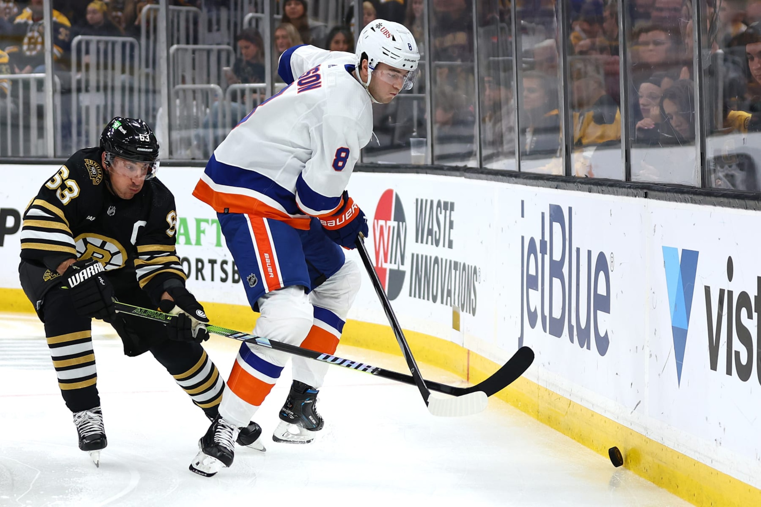 BOSTON, MASSACHUSETTS - NOVEMBER 09: Brad Marchand #63 of the Boston Bruins defends Noah Dobson #8 of the New York Islanders during the first period at TD Garden on November 09, 2023 in Boston, Massachusetts. (Photo by Maddie Meyer/Getty Images) BOSTON, MASSACHUSETTS - NOVEMBER 09: Brad Marchand #63 of the Boston Bruins defends Noah Dobson #8 of the New York Islanders during the first period at TD Garden on November 09, 2023 in Boston, Massachusetts. (Photo by Maddie Meyer/Getty Images)