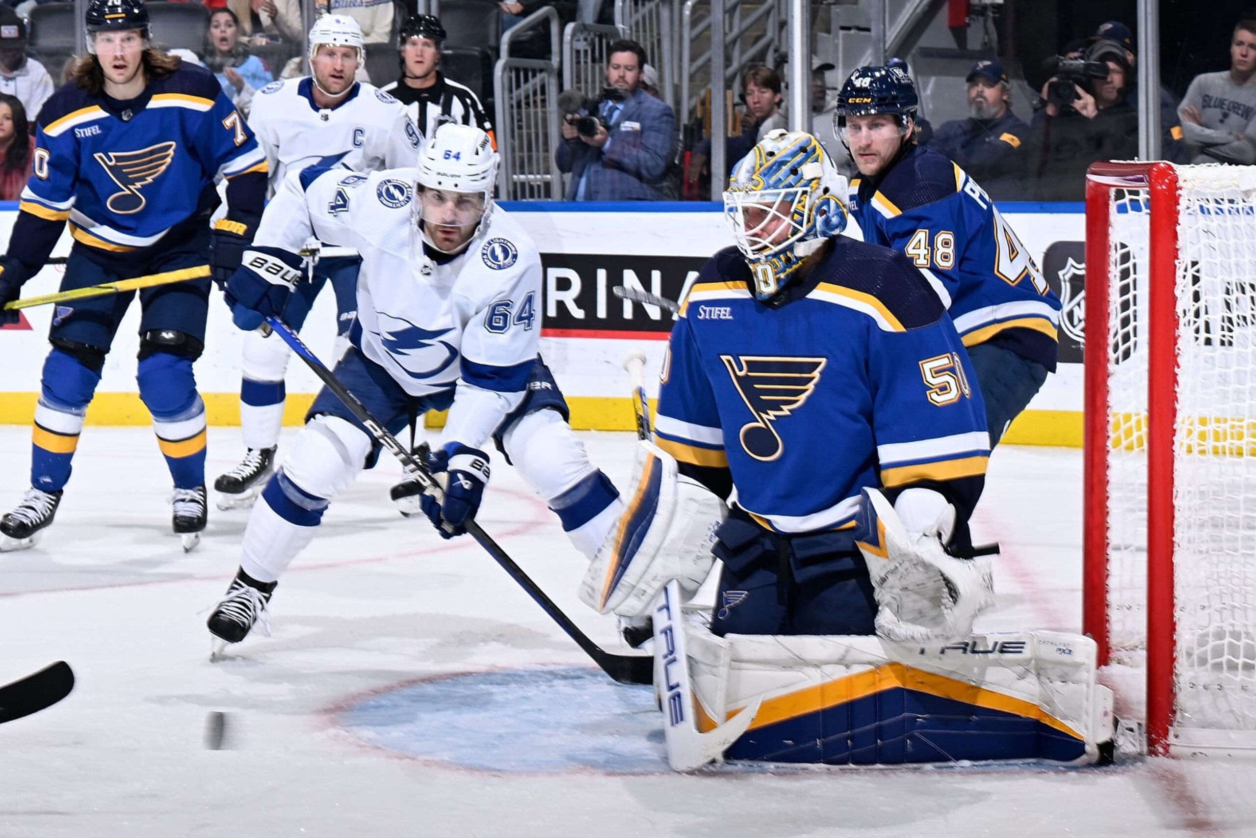 ST. LOUIS, MO - NOVEMBER 14: Jordan Binnington #50 of the St. Louis Blues defends the net against Tyler Motte #64 of the Tampa Bay Lightning on November 14, 2023 at the Enterprise Center in St. Louis, Missouri. (Photo by Scott Rovak/NHLI via Getty Images) ST. LOUIS, MO - NOVEMBER 14: Jordan Binnington #50 of the St. Louis Blues defends the net against Tyler Motte #64 of the Tampa Bay Lightning on November 14, 2023 at the Enterprise Center in St. Louis, Missouri. (Photo by Scott Rovak/NHLI via Getty Images)