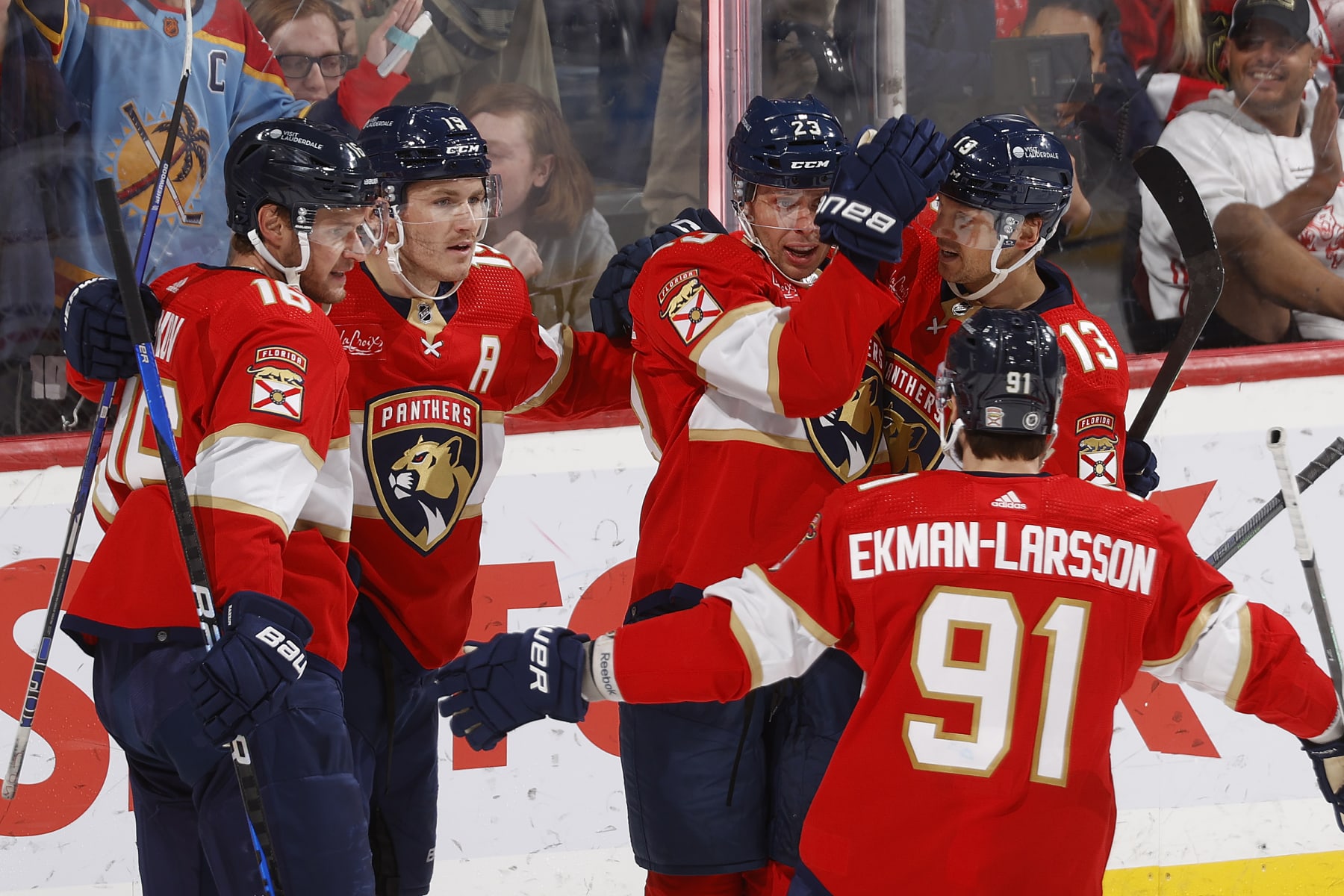 SUNRISE, FL - NOVEMBER 12: Teammates congratulate Carter Verhaeghe #23 of the Florida Panthers after he scored the go ahead goal against the Chicago Blackhawks during third period action at the Amerant Bank Arena on November 12, 2023 in Sunrise, Florida. (Photo by Joel Auerbach/Getty Images)
