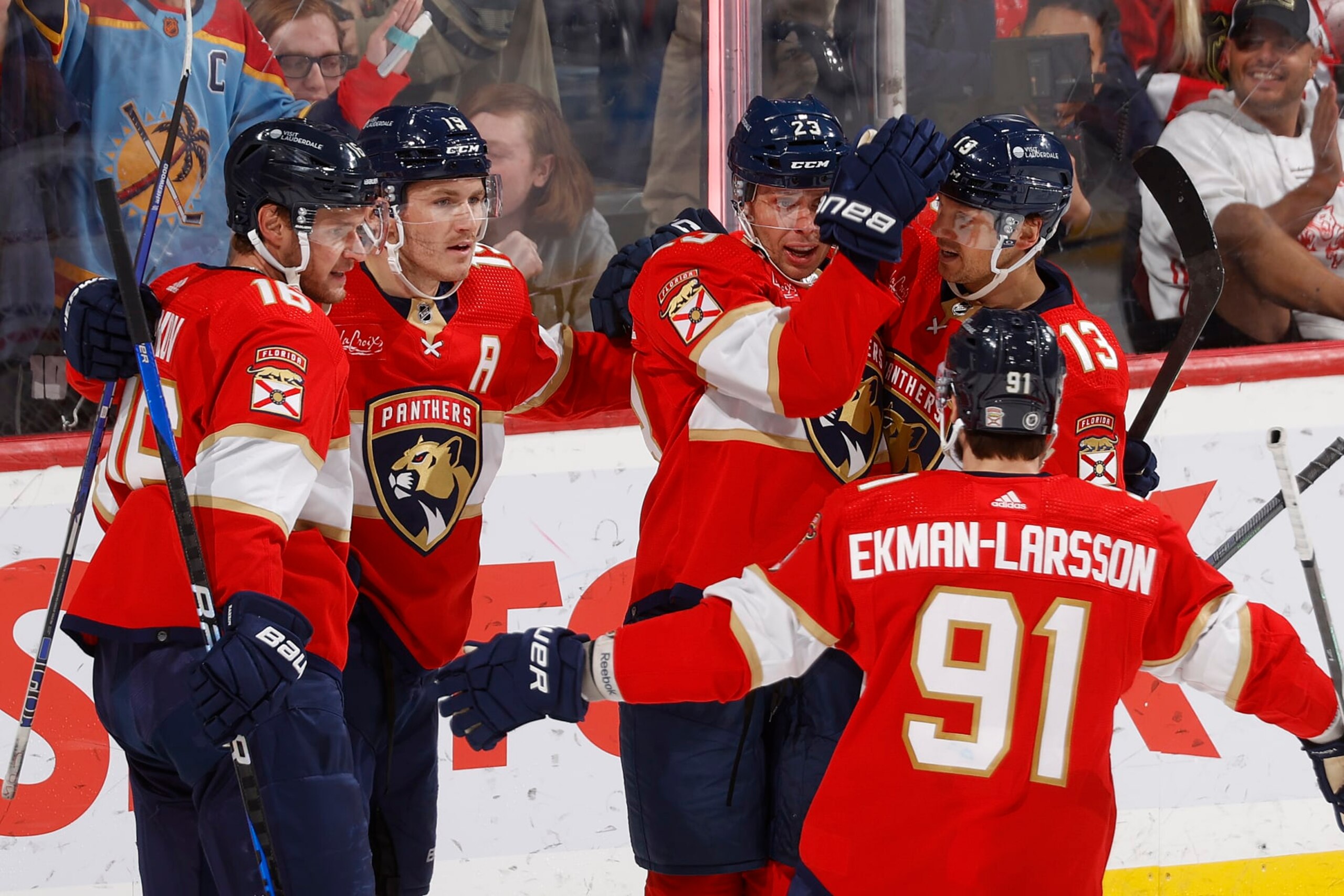 SUNRISE, FL - NOVEMBER 12: Teammates congratulate Carter Verhaeghe #23 of the Florida Panthers after he scored the go ahead goal against the Chicago Blackhawks during third period action at the Amerant Bank Arena on November 12, 2023 in Sunrise, Florida. (Photo by Joel Auerbach/Getty Images)