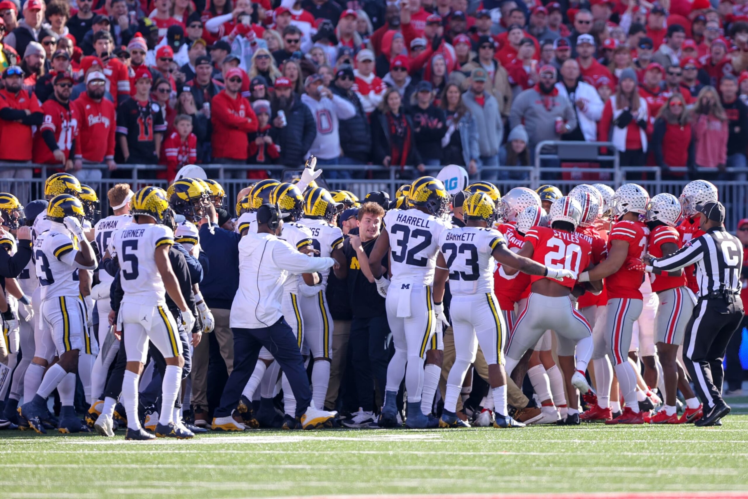 COLUMBUS, OH - NOVEMBER 26: Michigan Wolverines and Ohio State Buckeyes get into a scuffle on the sideline after a kickoff return during the second quarter of the college football game between the Michigan Wolverines and Ohio State Buckeyes on November 26, 2022, at Ohio Stadium in Columbus, OH. (Photo by Frank Jansky/Icon Sportswire via Getty Images)