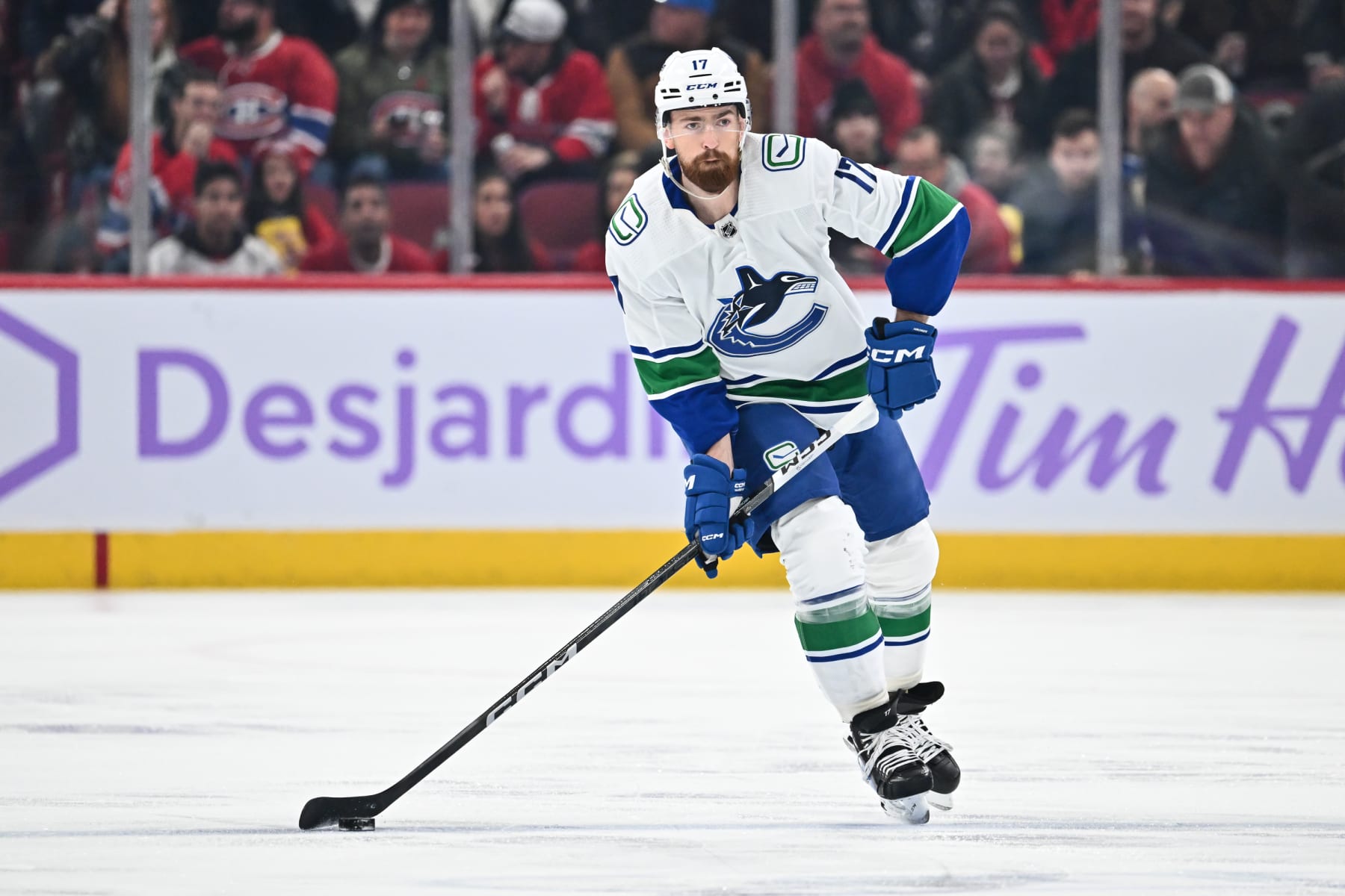 MONTREAL, CANADA - NOVEMBER 12:  Filip Hronek #17 of the Vancouver Canucks skates the puck during the first period against the Montreal Canadiens at the Bell Centre on November 12, 2023 in Montreal, Quebec, Canada.  The Vancouver Canucks defeated the Montreal Canadiens 5-2.  (Photo by Minas Panagiotakis/Getty Images)