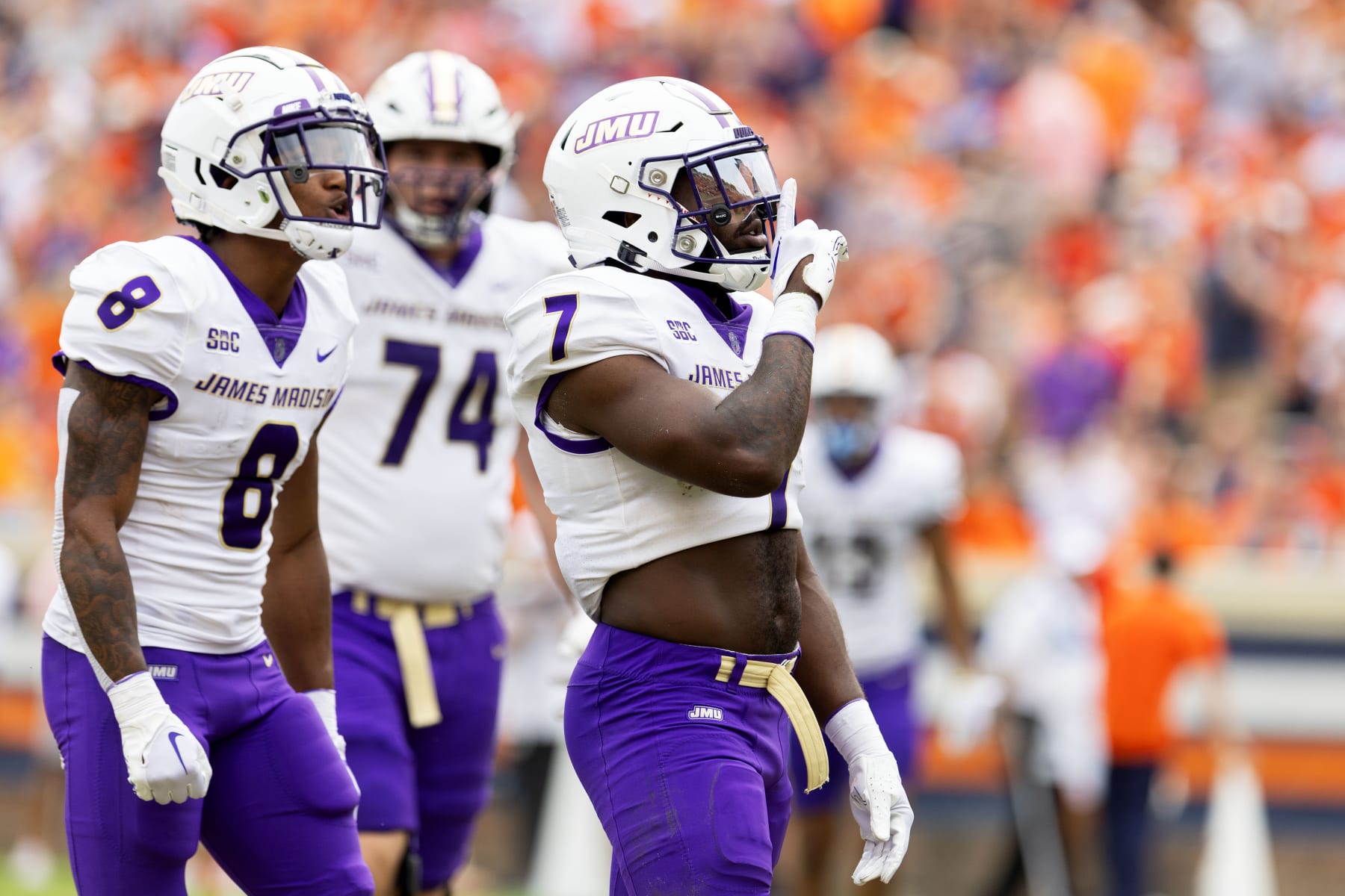 CHARLOTTESVILLE, VIRGINIA - SEPTEMBER 9: Ty Son Lawton #7 of the James Madison Dukes silences the crowd after scoring a touchdown in the second half during a game against the Virginia Cavaliers at Scott Stadium on September 9, 2023 in Charlottesville, Virginia. (Photo by Ryan M. Kelly/Getty Images)