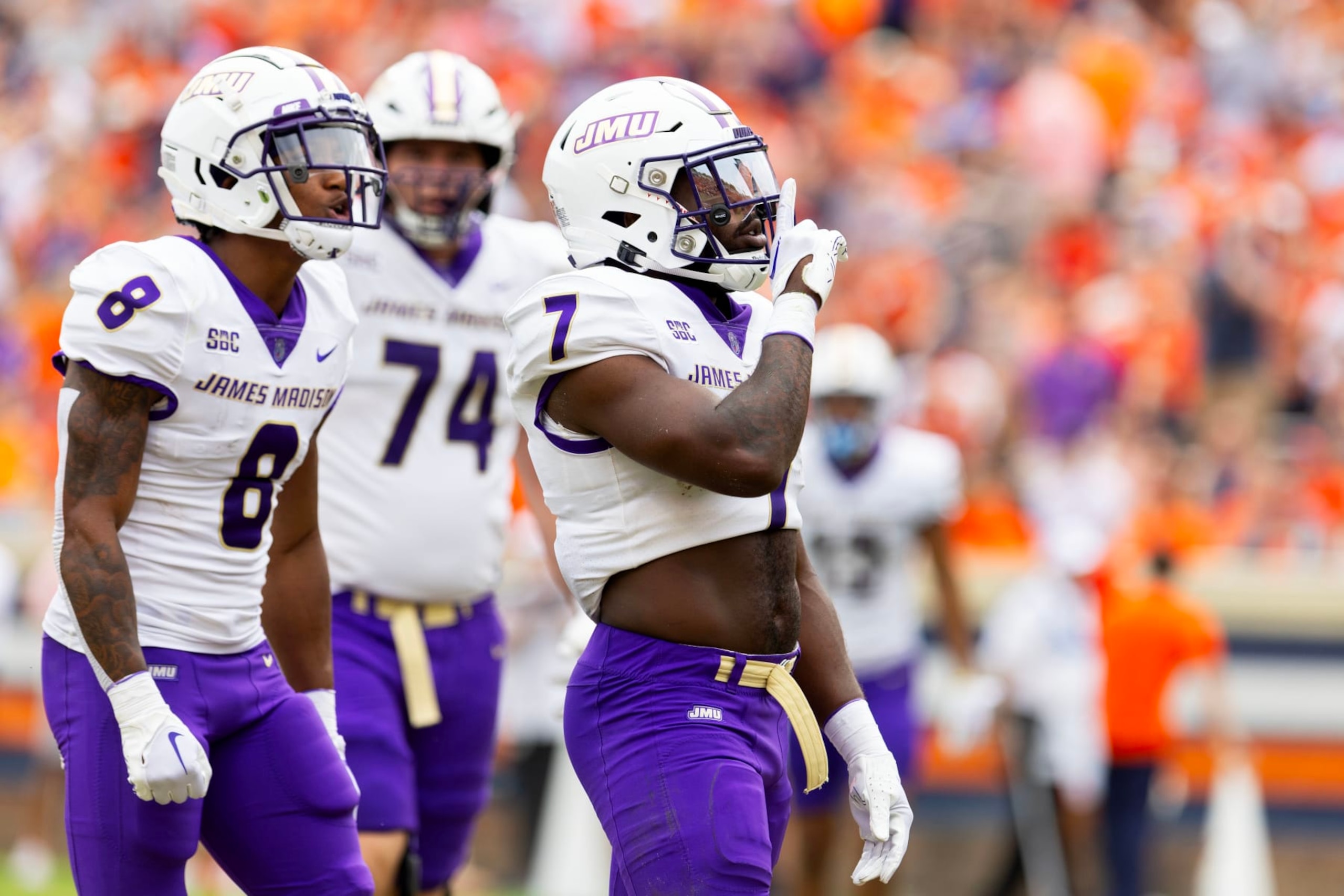 CHARLOTTESVILLE, VIRGINIA - SEPTEMBER 9: Ty Son Lawton #7 of the James Madison Dukes silences the crowd after scoring a touchdown in the second half during a game against the Virginia Cavaliers at Scott Stadium on September 9, 2023 in Charlottesville, Virginia. (Photo by Ryan M. Kelly/Getty Images)