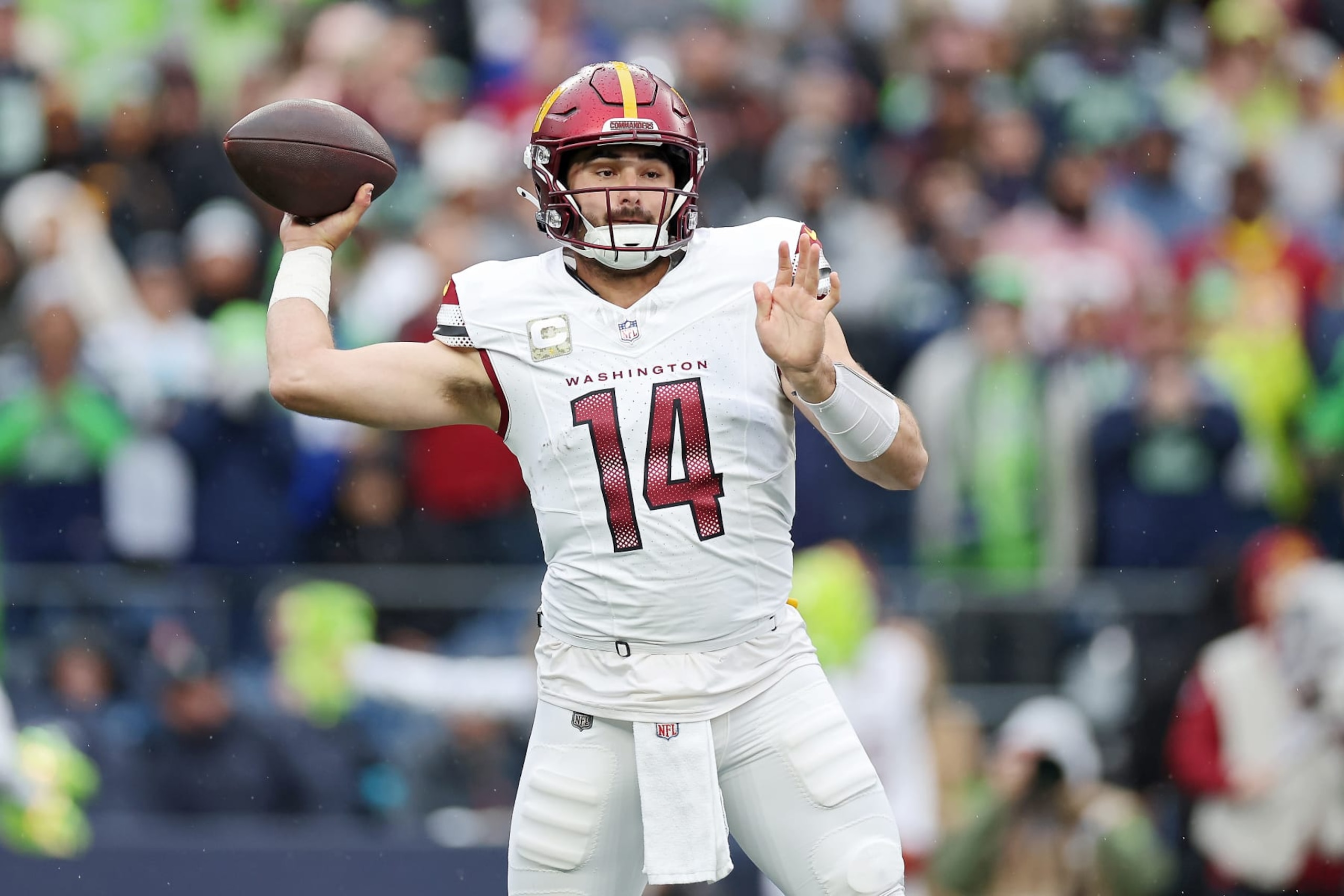 SEATTLE, WASHINGTON - NOVEMBER 12: Sam Howell #14 of the Washington Commanders attempts a pass during the first quarter against the Seattle Seahawks at Lumen Field on November 12, 2023 in Seattle, Washington. (Photo by Steph Chambers/Getty Images)