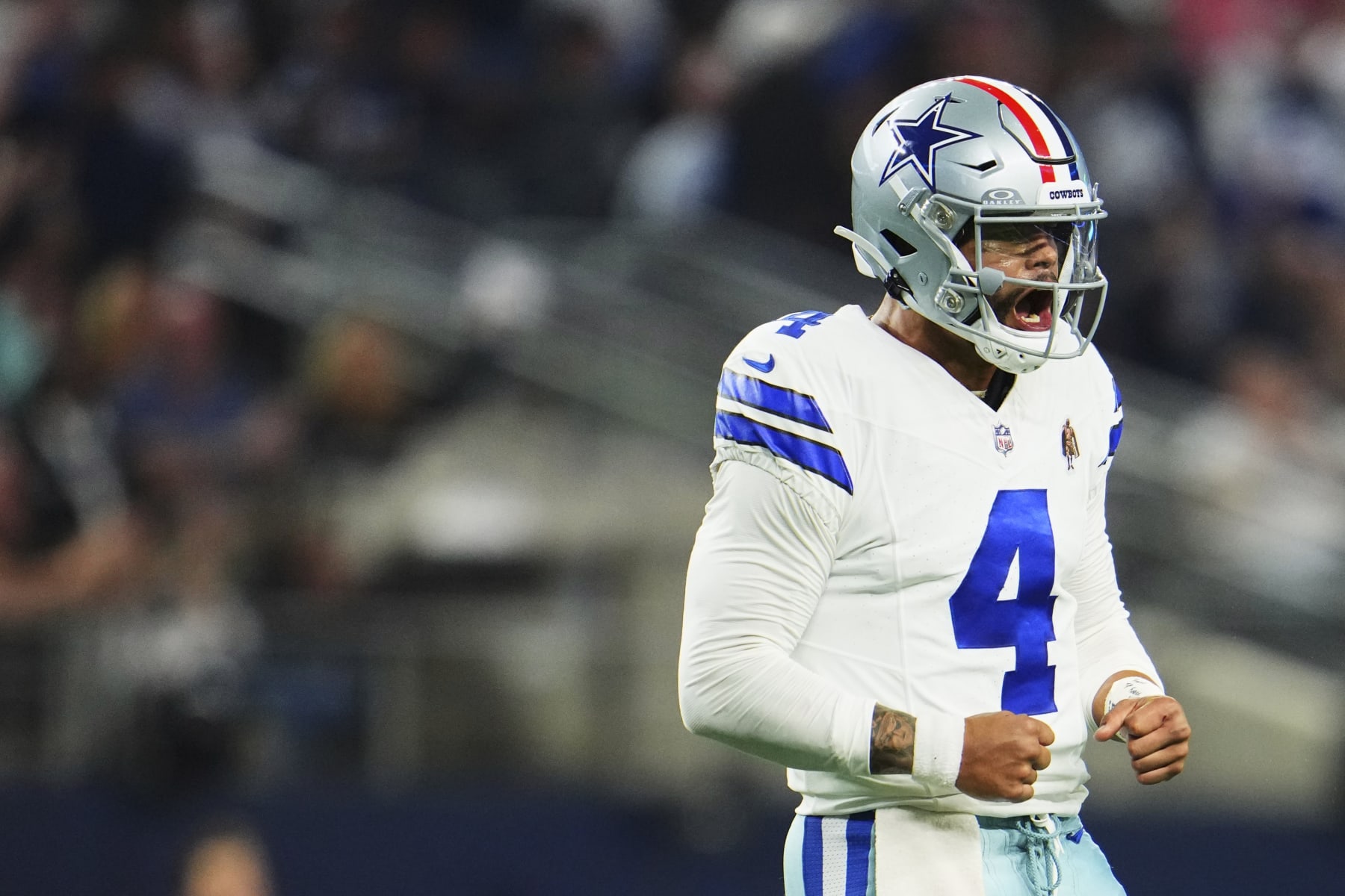 ARLINGTON, TX - NOVEMBER 12: Dak Prescott #4 of the Dallas Cowboys celebrates after scoring a touchdown against the New York Giants during the second half at AT&T Stadium on November 12, 2023 in Arlington, Texas. (Photo by Cooper Neill/Getty Images)