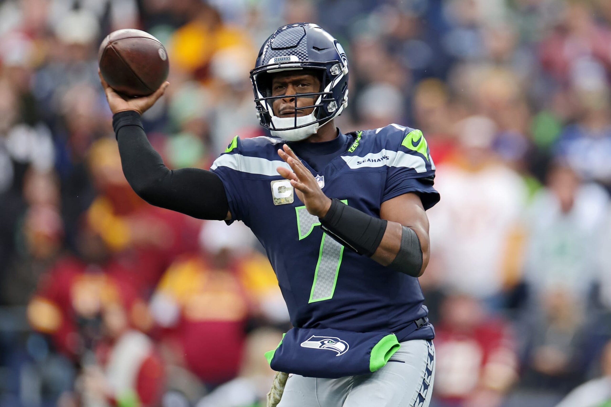 SEATTLE, WASHINGTON - NOVEMBER 12: Geno Smith #7 of the Seattle Seahawks attempts a pass during the first quarter against the Washington Commanders at Lumen Field on November 12, 2023 in Seattle, Washington. (Photo by Steph Chambers/Getty Images)
