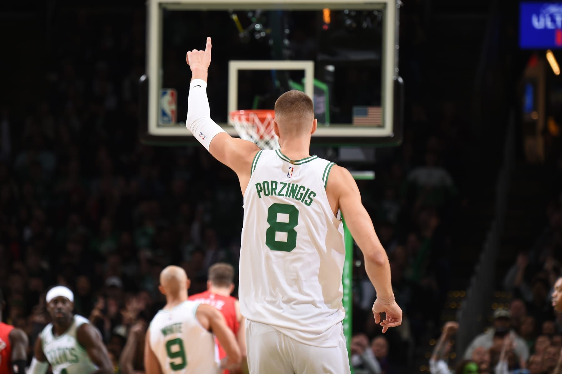 BOSTON, MA - NOVEMBER 11: Kristaps Porzingis #8 of the Boston Celtics celebrates a three point basket during the game against the Toronto Raptors on November 11, 2023 at the TD Garden in Boston, Massachusetts. NOTE TO USER: User expressly acknowledges and agrees that, by downloading and or using this photograph, User is consenting to the terms and conditions of the Getty Images License Agreement. Mandatory Copyright Notice: Copyright 2023 NBAE  (Photo by Brian Babineau/NBAE via Getty Images)