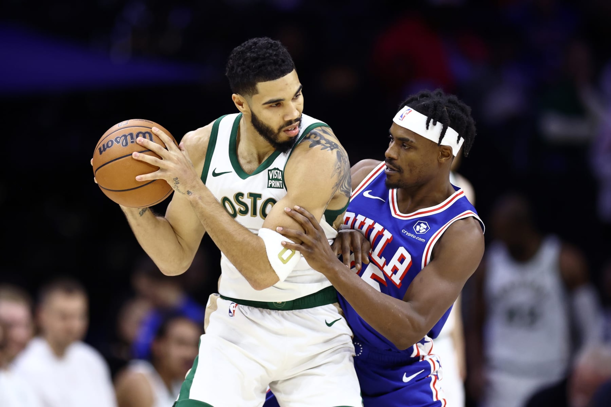PHILADELPHIA, PENNSYLVANIA - NOVEMBER 15: Jayson Tatum #0 of the Boston Celtics is guarded by Danuel House Jr. #25 of the Philadelphia 76ers during the first quarterat the Wells Fargo Center on November 15, 2023 in Philadelphia, Pennsylvania. NOTE TO USER: User expressly acknowledges and agrees that, by downloading and or using this photograph, User is consenting to the terms and conditions of the Getty Images License Agreement. (Photo by Tim Nwachukwu/Getty Images)