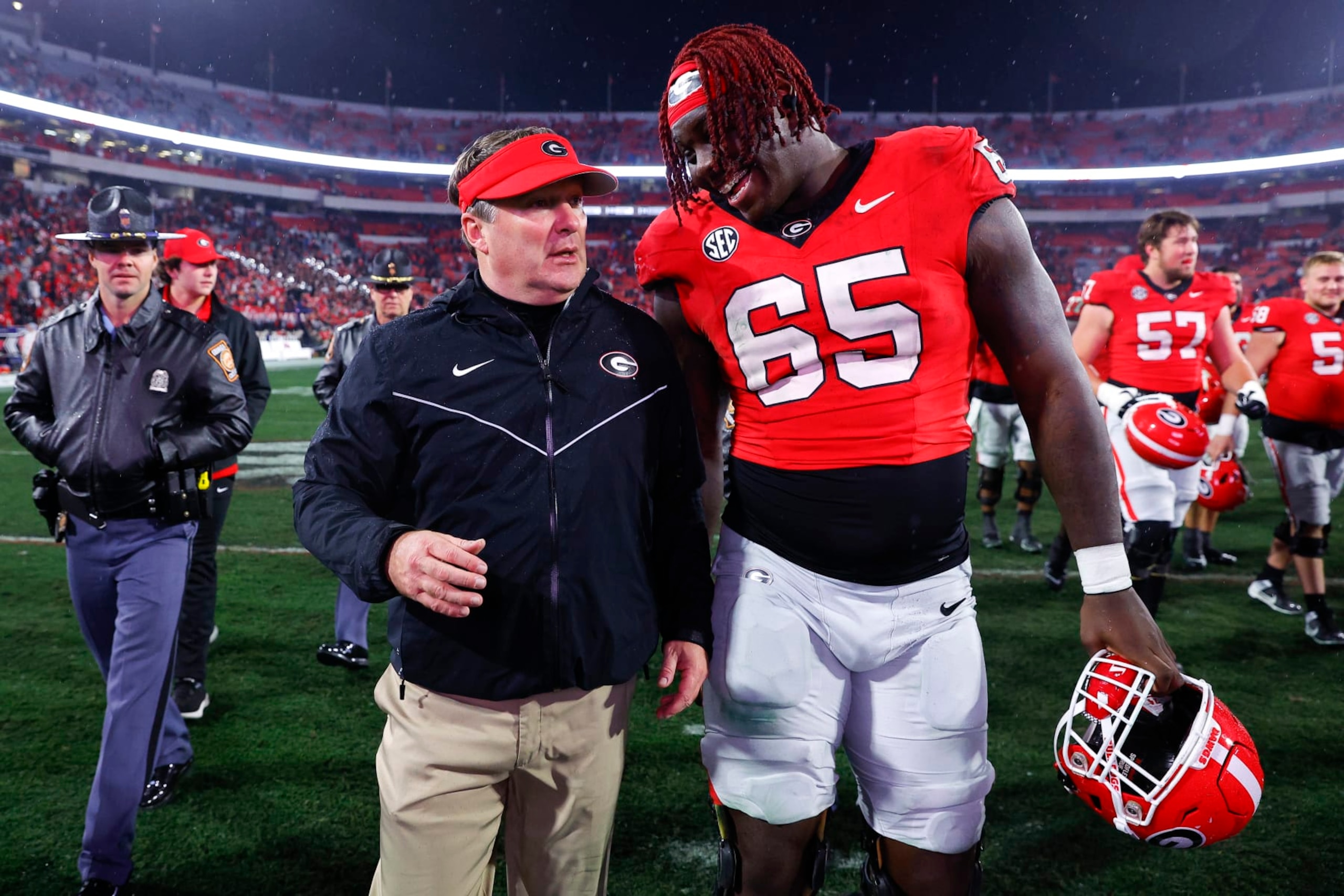 ATHENS, GEORGIA - NOVEMBER 11: Head coach Kirby Smart reacts with Amarius Mims #65 of the Georgia Bulldogs following the 52-17 victory over the DATA: # of the Mississippi Rebels at Sanford Stadium on November 11, 2023 in Athens, Georgia. (Photo by Todd Kirkland/Getty Images)