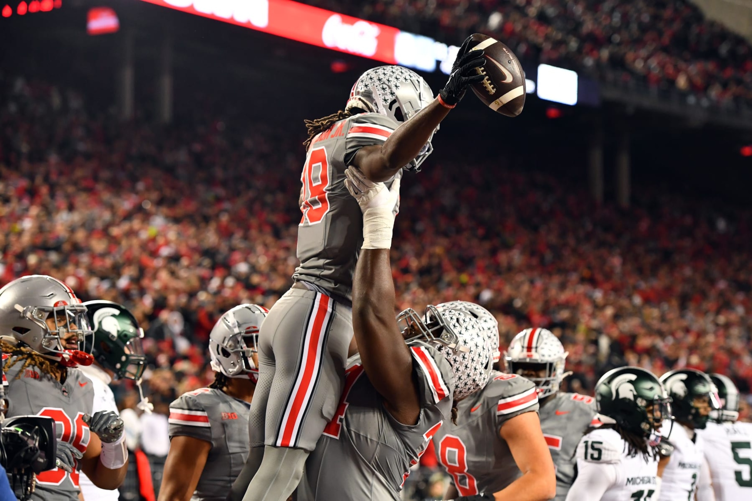 COLUMBUS, OHIO - NOVEMBER 11: Marvin Harrison Jr. #18 of the Ohio State Buckeyes celebrates his first quarter touchdown with teammate Donovan Jackson #74 of the Ohio State Buckeyes during a game against the Michigan State Spartans at Ohio Stadium on November 11, 2023 in Columbus, Ohio. (Photo by Ben Jackson/Getty Images)