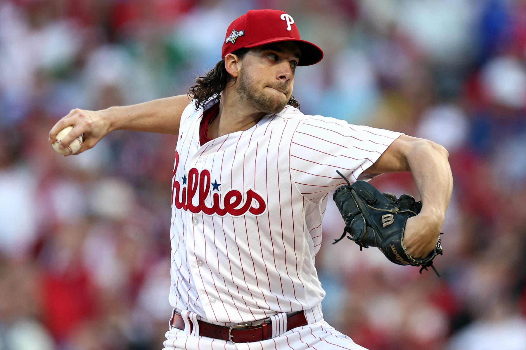 PHILADELPHIA, PENNSYLVANIA - OCTOBER 23: Aaron Nola #27 of the Philadelphia Phillies pitches in the first inning against the Arizona Diamondbacks during Game Six of the Championship Series at Citizens Bank Park on October 23, 2023 in Philadelphia, Pennsylvania. (Photo by Elsa/Getty Images)
