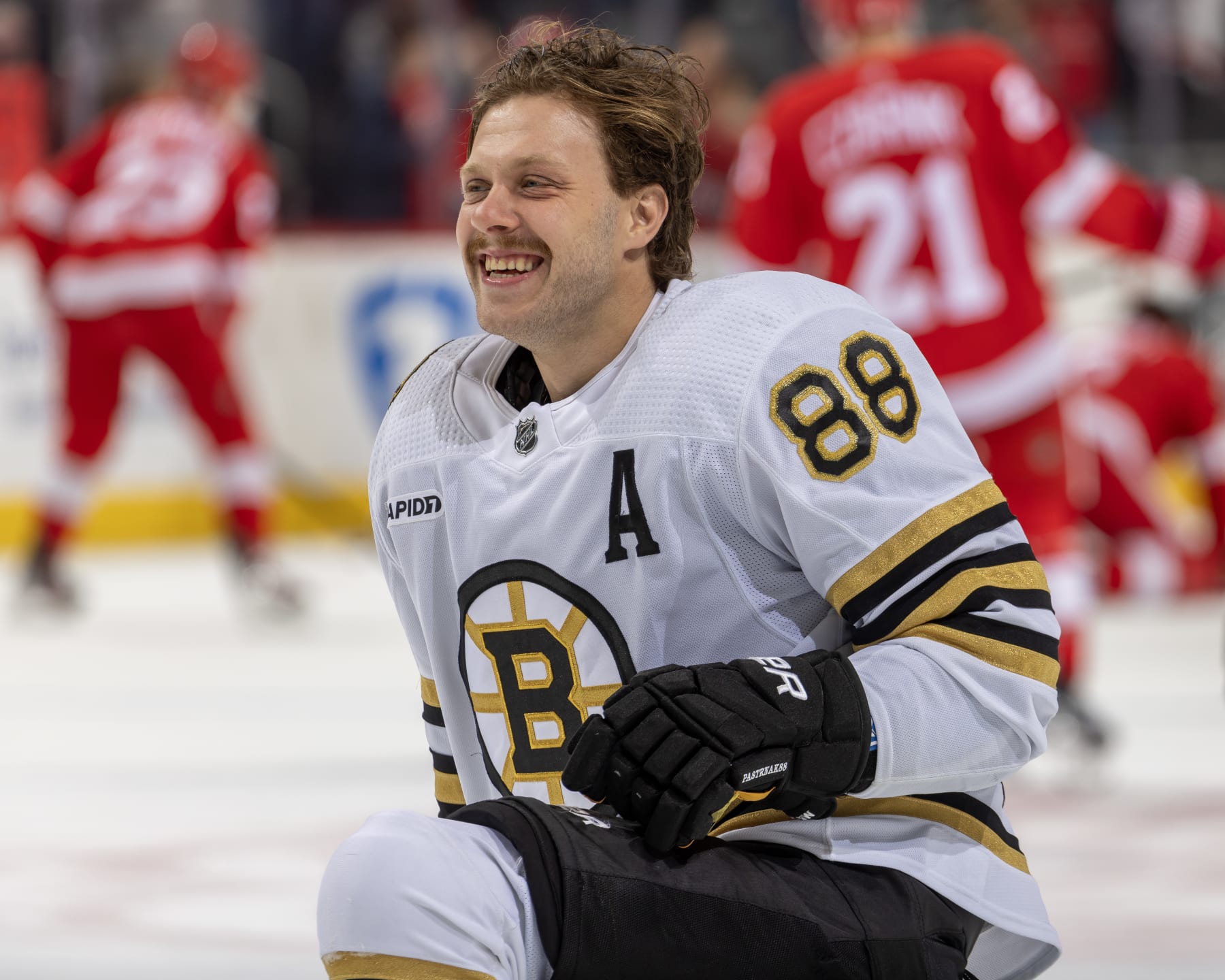 DETROIT, MI - NOVEMBER 04: David Pastrnak #88 of the Boston Bruins smiles in warm ups before the game against the Detroit Red Wings at Little Caesars Arena on November 4, 2023 in Detroit, Michigan. (Photo by Dave Reginek/NHLI via Getty Images)