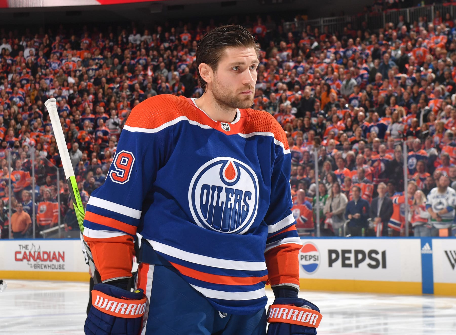 EDMONTON, CANADA - OCTOBER 14: Leon Draisaitl #29 of the Edmonton Oilers stands for the playing of the national anthem before the game against the Vancouver Canucks at Rogers Place on October 14, 2023, in Edmonton, Alberta, Canada. (Photo by Andy Devlin/NHLI via Getty Images)