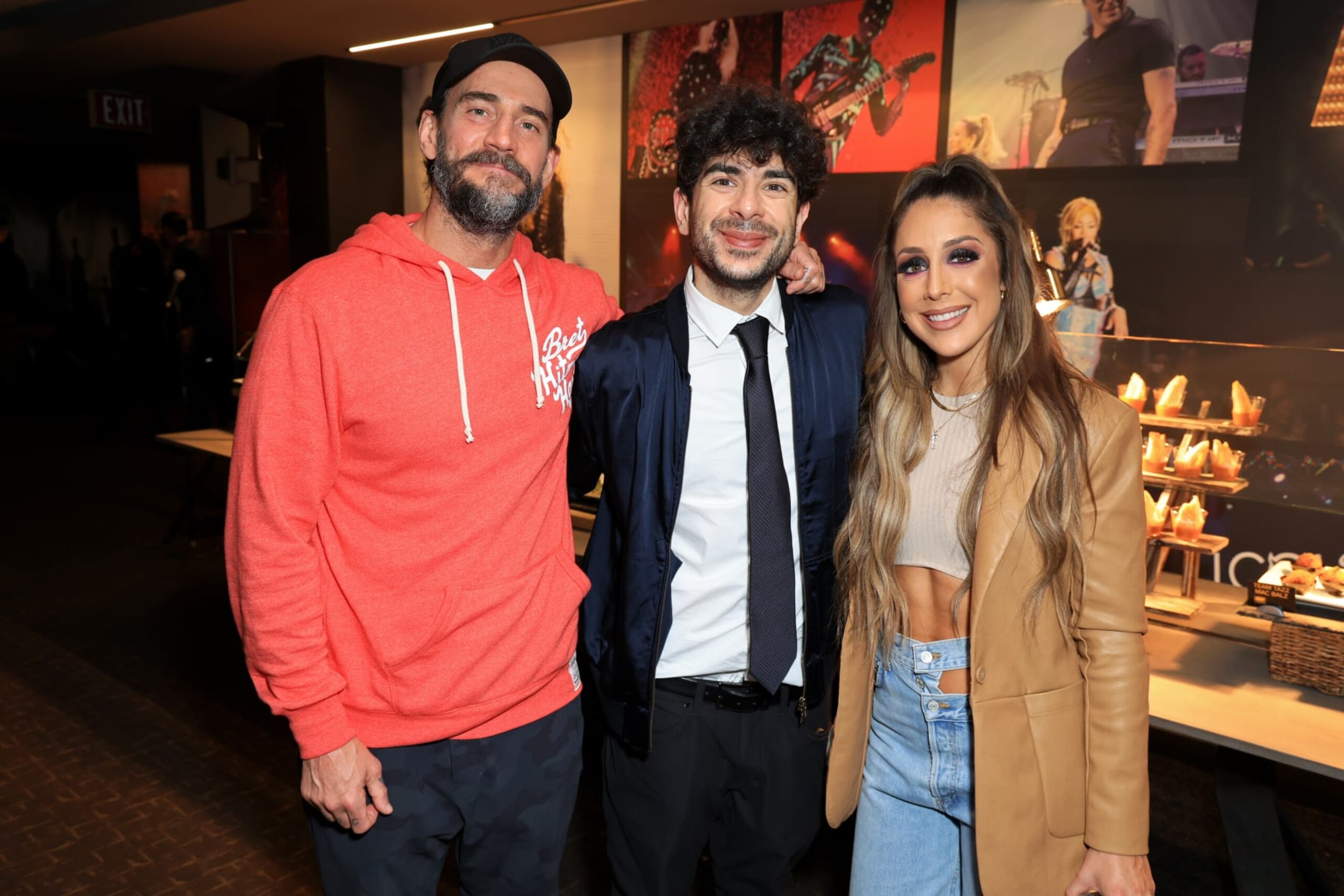 INGLEWOOD, CALIFORNIA - JUNE 01: (L-R) CM Punk, President of All Elite Wrestling Tony Khan and Britt Baker, D.M.D. attend TBS's AEW Dynamite Los Angeles Debut After Party at The Forum on June 01, 2022 in Inglewood, California. (Photo by Leon Bennett/Getty Images for Warner Bros. Discovery)