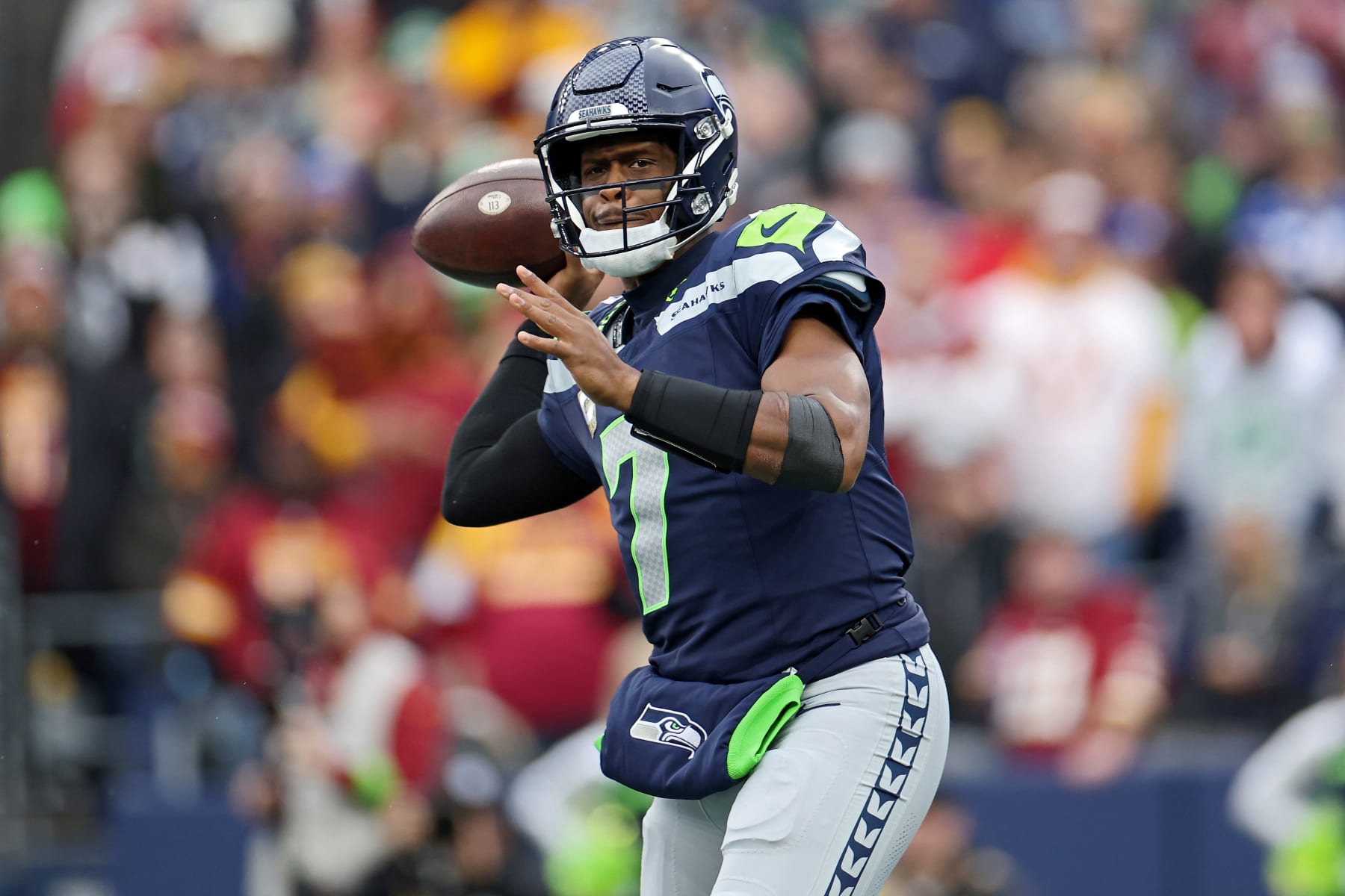 SEATTLE, WASHINGTON - NOVEMBER 12: Geno Smith #7 of the Seattle Seahawks attempts a pass during the first quarter against the Washington Commanders at Lumen Field on November 12, 2023 in Seattle, Washington. (Photo by Steph Chambers/Getty Images)