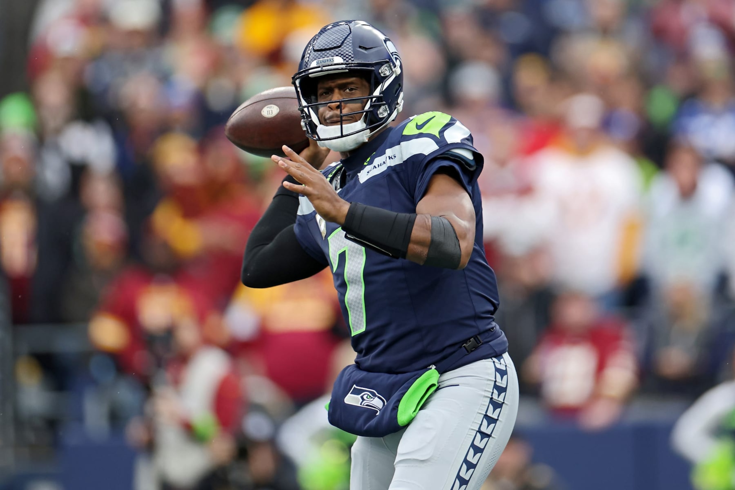 SEATTLE, WASHINGTON - NOVEMBER 12: Geno Smith #7 of the Seattle Seahawks attempts a pass during the first quarter against the Washington Commanders at Lumen Field on November 12, 2023 in Seattle, Washington. (Photo by Steph Chambers/Getty Images)