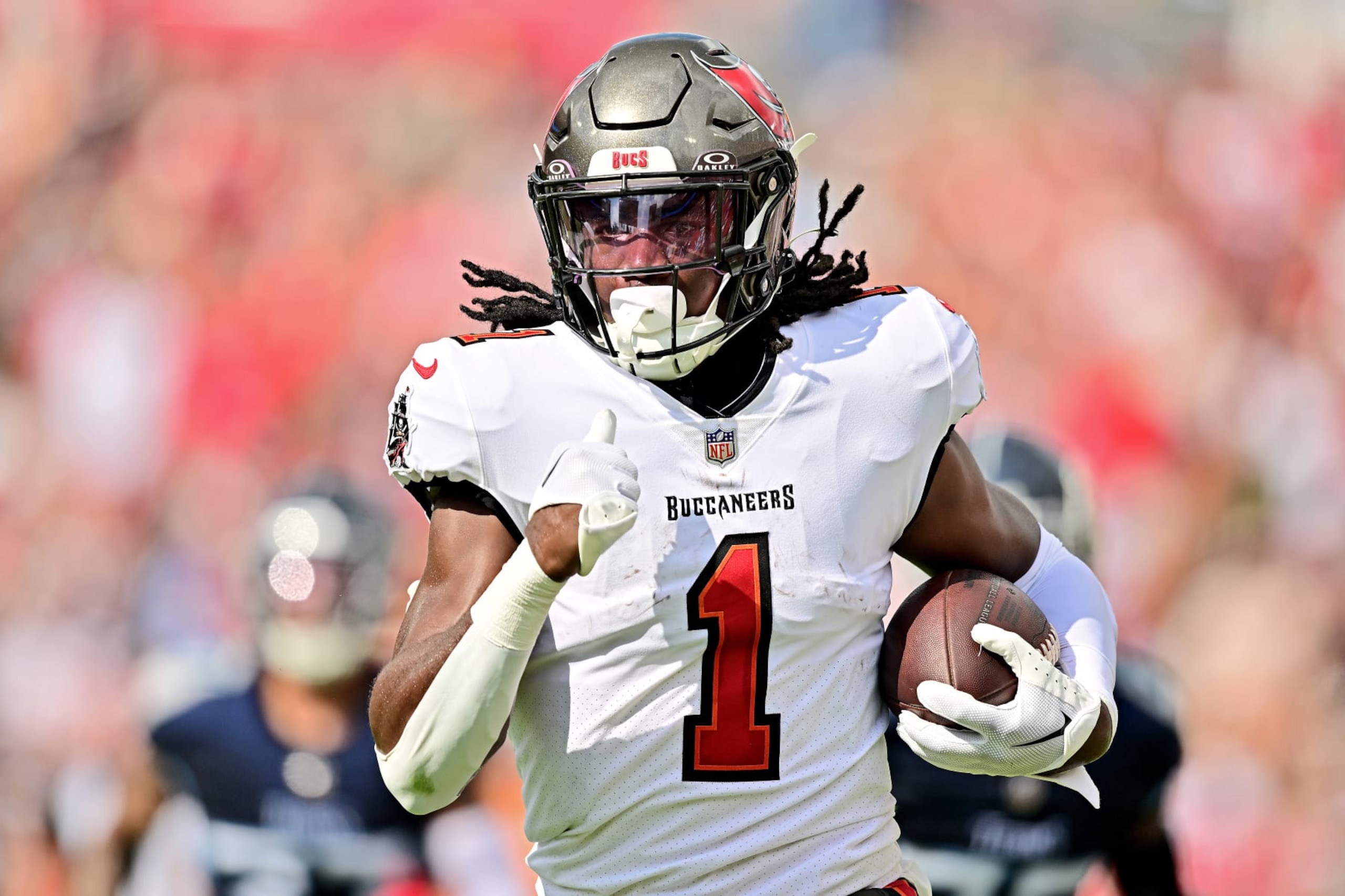 TAMPA, FLORIDA - NOVEMBER 12: Rachaad White #1 of the Tampa Bay Buccaneers runs while scoring a receiving touchdown against the Tennessee Titans during the second quarter at Raymond James Stadium on November 12, 2023 in Tampa, Florida. (Photo by Julio Aguilar/Getty Images)