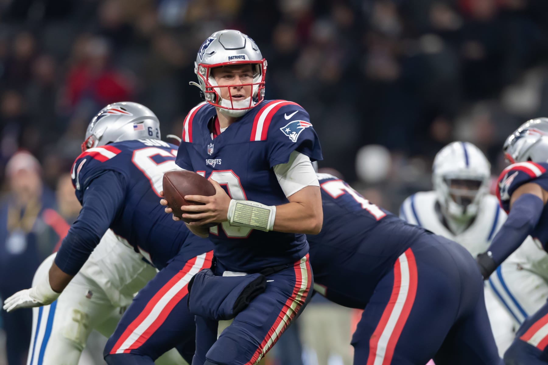 FRANKFURT AM MAIN, GERMANY - NOVEMBER 12: Mac Jones of New England Patriots controls the ball during the NFL match between Indianapolis Colts and New England Patriots at Deutsche Bank Park on November 12, 2023 in Frankfurt am Main, Germany. (Photo by Mario Hommes/DeFodi Images via Getty Images)