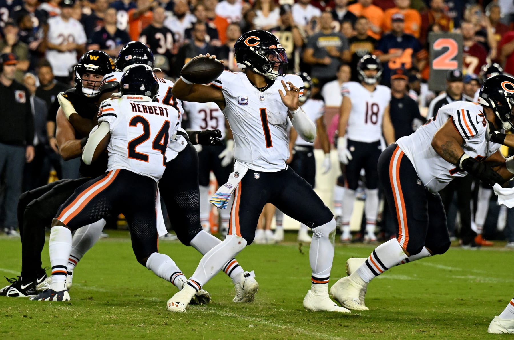 LANDOVER, MARYLAND - OCTOBER 05: Justin Fields #1 of the Chicago Bears throws a pass against the Washington Commanders at FedExField on October 05, 2023 in Landover, Maryland. (Photo by G Fiume/Getty Images)