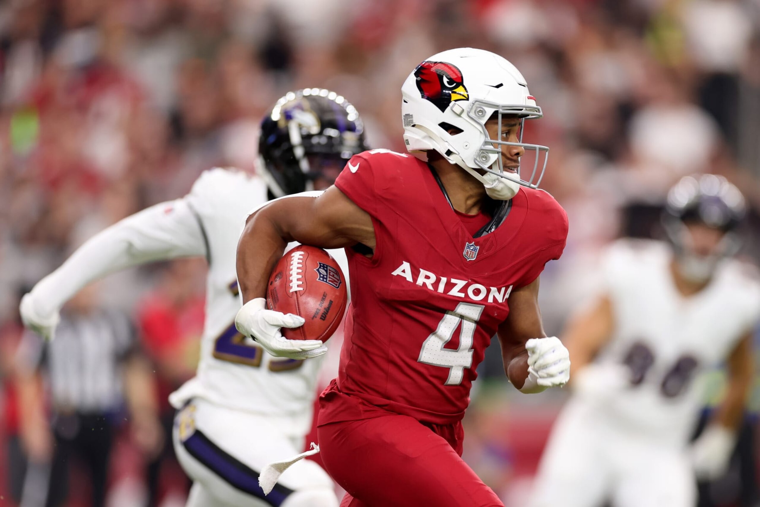 GLENDALE, ARIZONA - OCTOBER 29: Rondale Moore #4 of the Arizona Cardinals returns a punt during the third quarter against the Baltimore Ravens at State Farm Stadium on October 29, 2023 in Glendale, Arizona. (Photo by Christian Petersen/Getty Images)