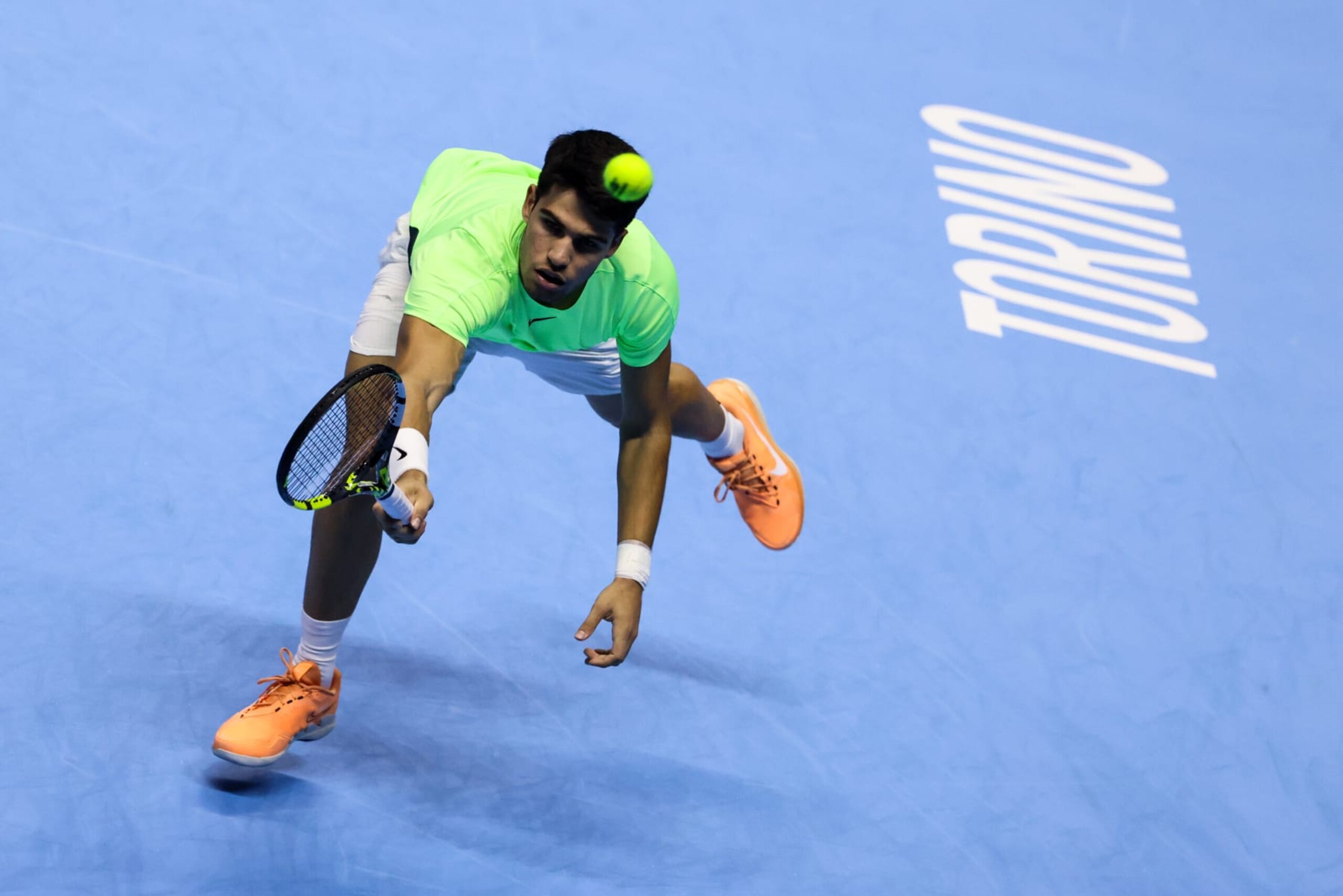 TURIN, ITALY - NOVEMBER 15: Carlos Alcaraz of Spain plays a backhand in the Men's Singles Round Robin match against Andrey Rublev during day four of the Nitto ATP Finals at Pala Alpitour on November 15, 2023 in Turin, Italy. (Photo by Shi Tang/Getty Images)
